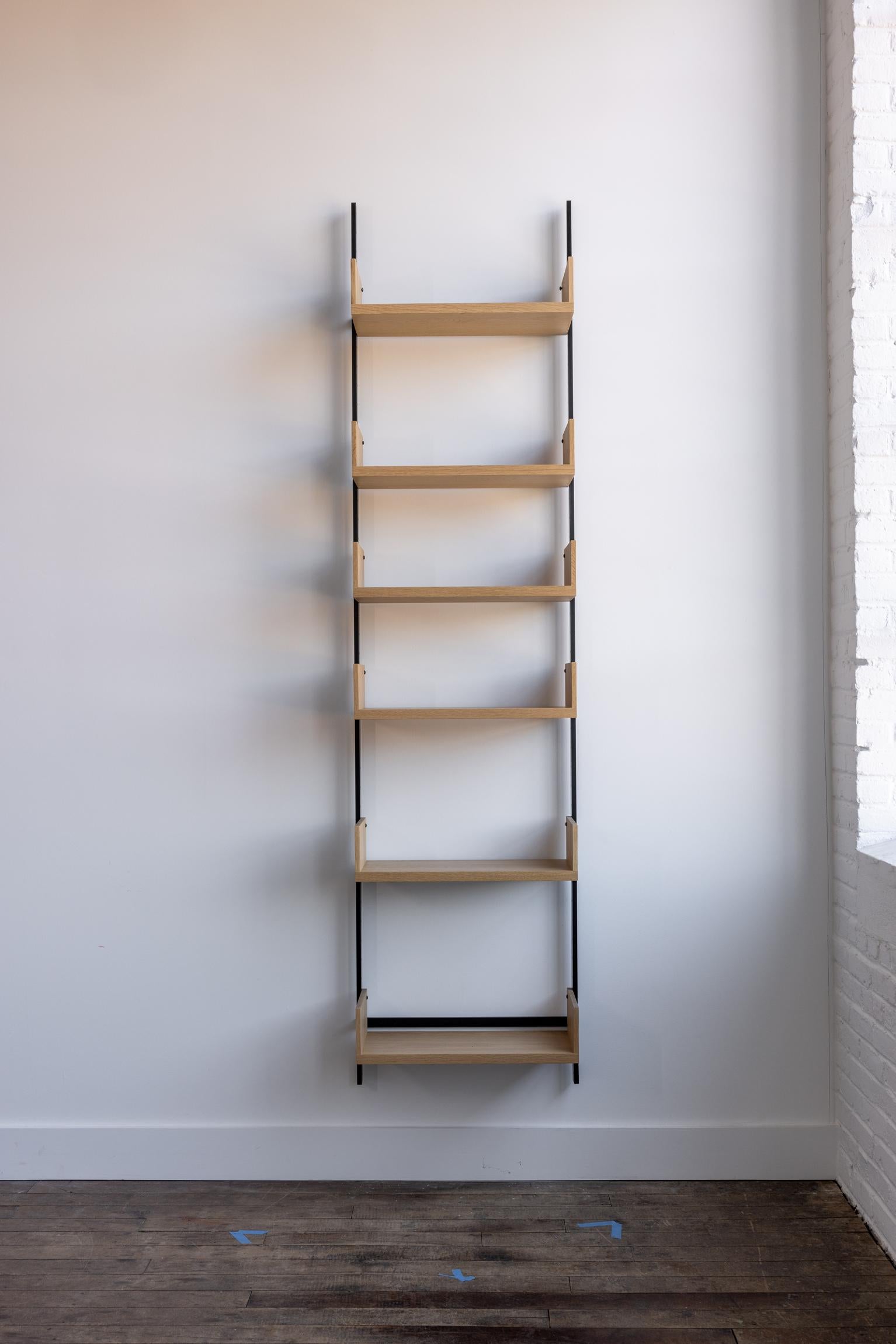 The AS4 modular shelving unit is handmade using solid hardwood with dovetail joinery, and solid steel.  This single-bay shelving unit can easily be rearranged, expanded upon, and relocated - adapting to your needs as they change (unlike traditional