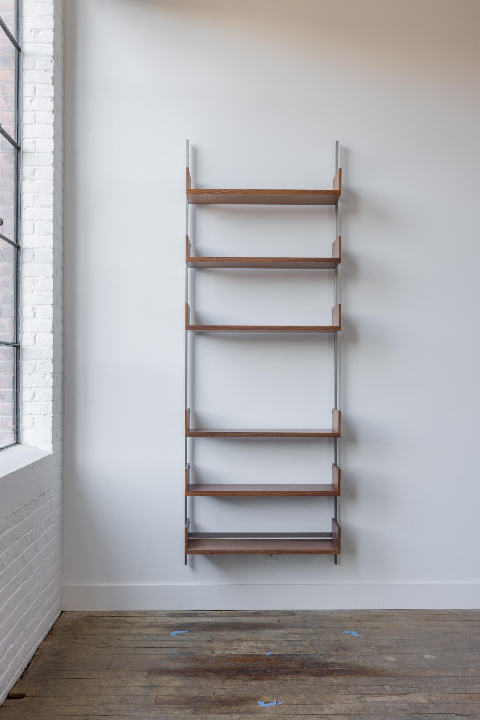 The AS4 modular shelving unit is handmade using solid hardwood with dovetail joinery, and solid steel.  This single-bay shelving unit can easily be rearranged, expanded upon, and relocated - adapting to your needs as they change (unlike traditional
