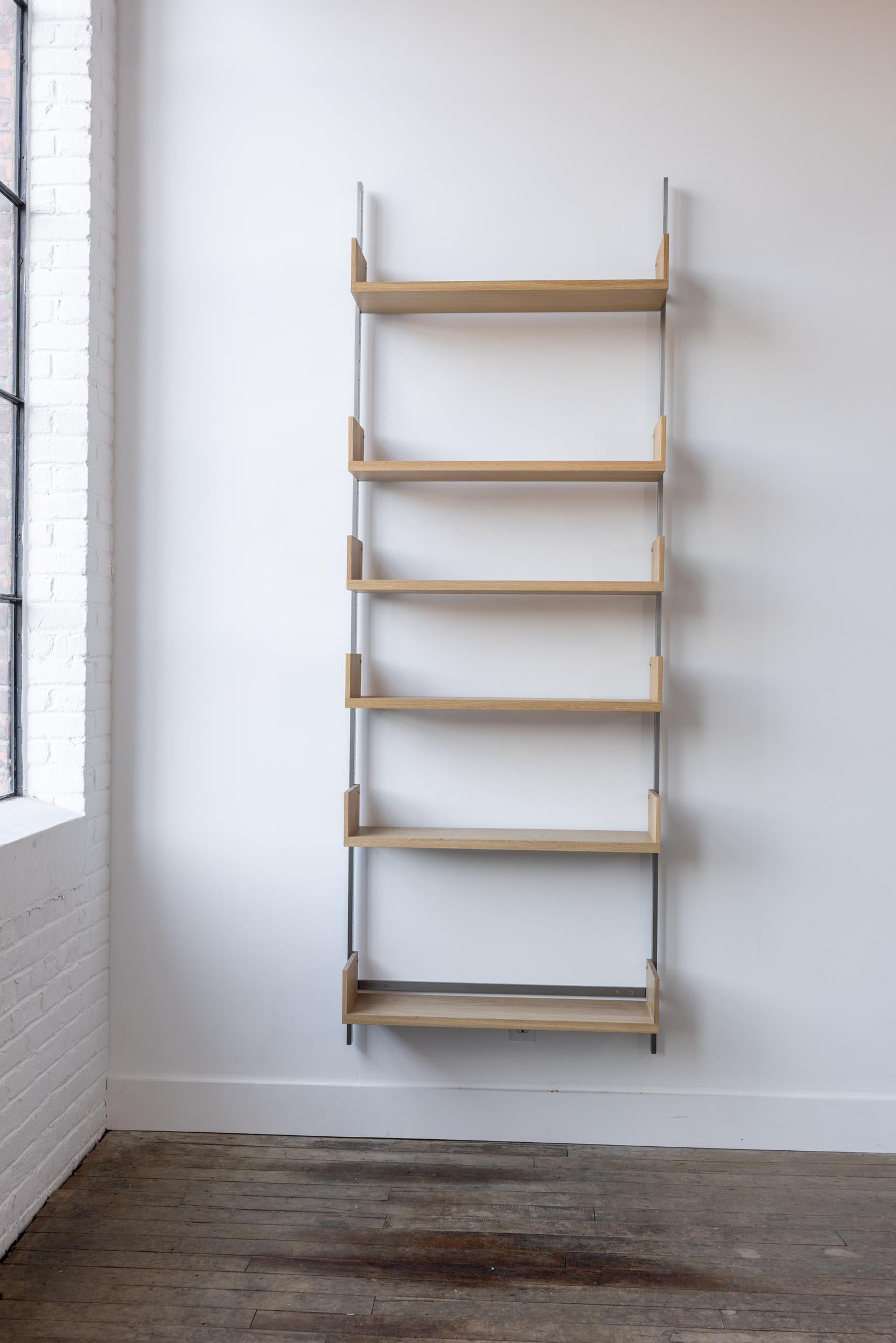The AS4 modular shelving unit is handmade using solid hardwood with dovetail joinery, and solid steel.  This single-bay shelving unit can easily be rearranged, expanded upon, and relocated - adapting to your needs as they change (unlike traditional