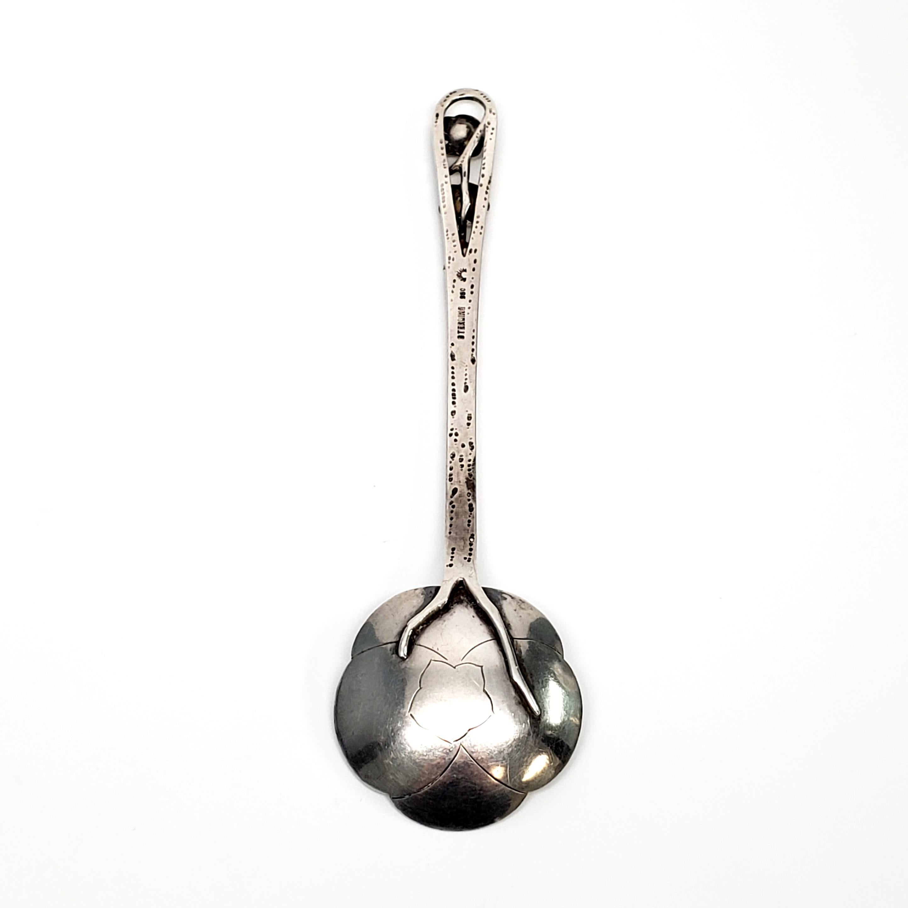 Asahi Shoten Japanese 950 silver lotus flower spoon.

The well known Japanese shop Asahi Shoten opened in the 1890s in Kannai, a district in Yokohama. This beautiful spoon has 2 small lotus flowers on a stem at the top of the handle, and the bowl