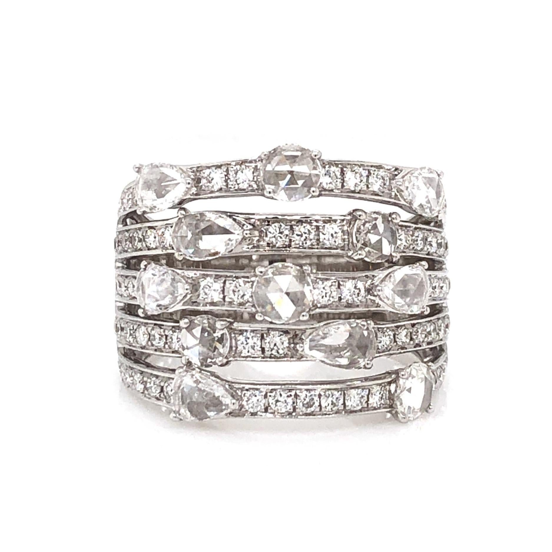 The ASBA Collection 5 Row Band showcases 12 rose-cut diamonds set in 18k White Gold. It also features 0.74tcw of Paved Round Brilliant Cut Diamonds, totaling 1.84cts t.w. This exquisite ring measures 15mm in width and is available in size 7,