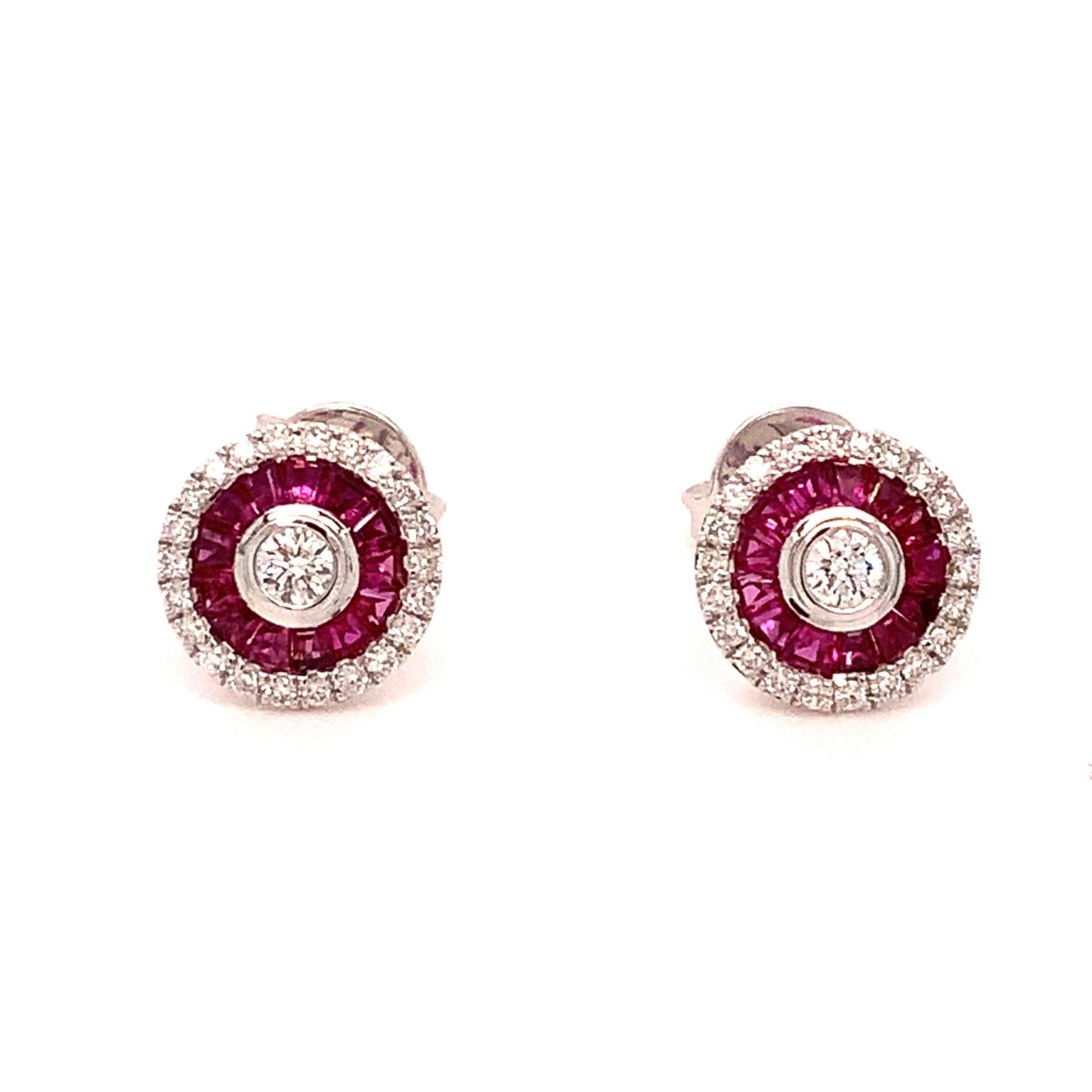 This stunning Deco Style Earring features 0.50cts T.W. of Tapered Baguette Rubies with a Fine-Medium Dark Red hue, as well as 0.33cts T.W. of Brilliant Cut Diamonds in F Color and SI Clarity, crafted with top-notch Make and Polish. The Earring has a