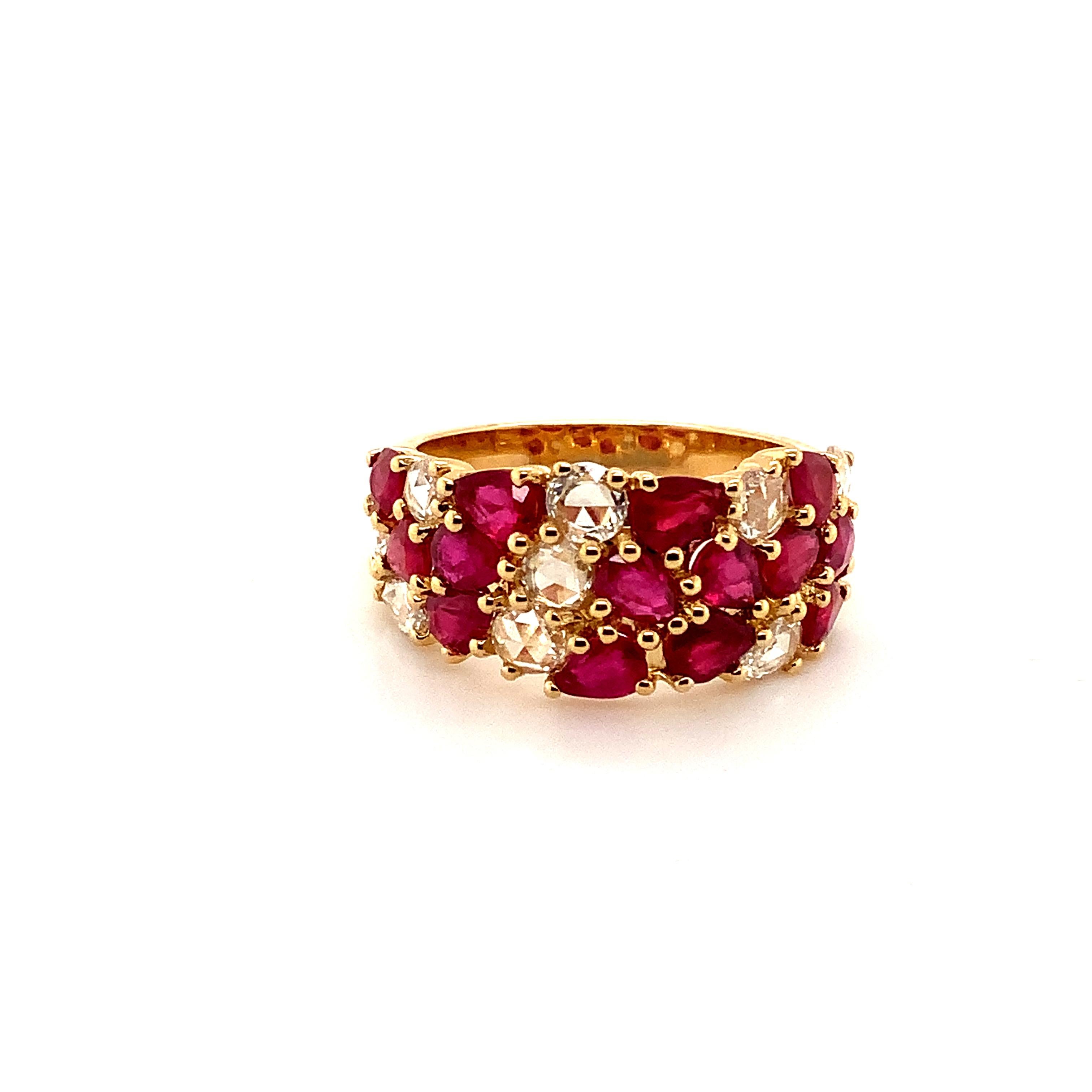 This Three Row Band from ASBA Collection features stunning Fine Ruby and Rose Cut Diamonds set in 18K Yellow Gold. The low profile design offers effortless wearability. With 9 Round Rose Cut Diamonds totaling 0.73 ct. tw. in F Color and VS Clarity,