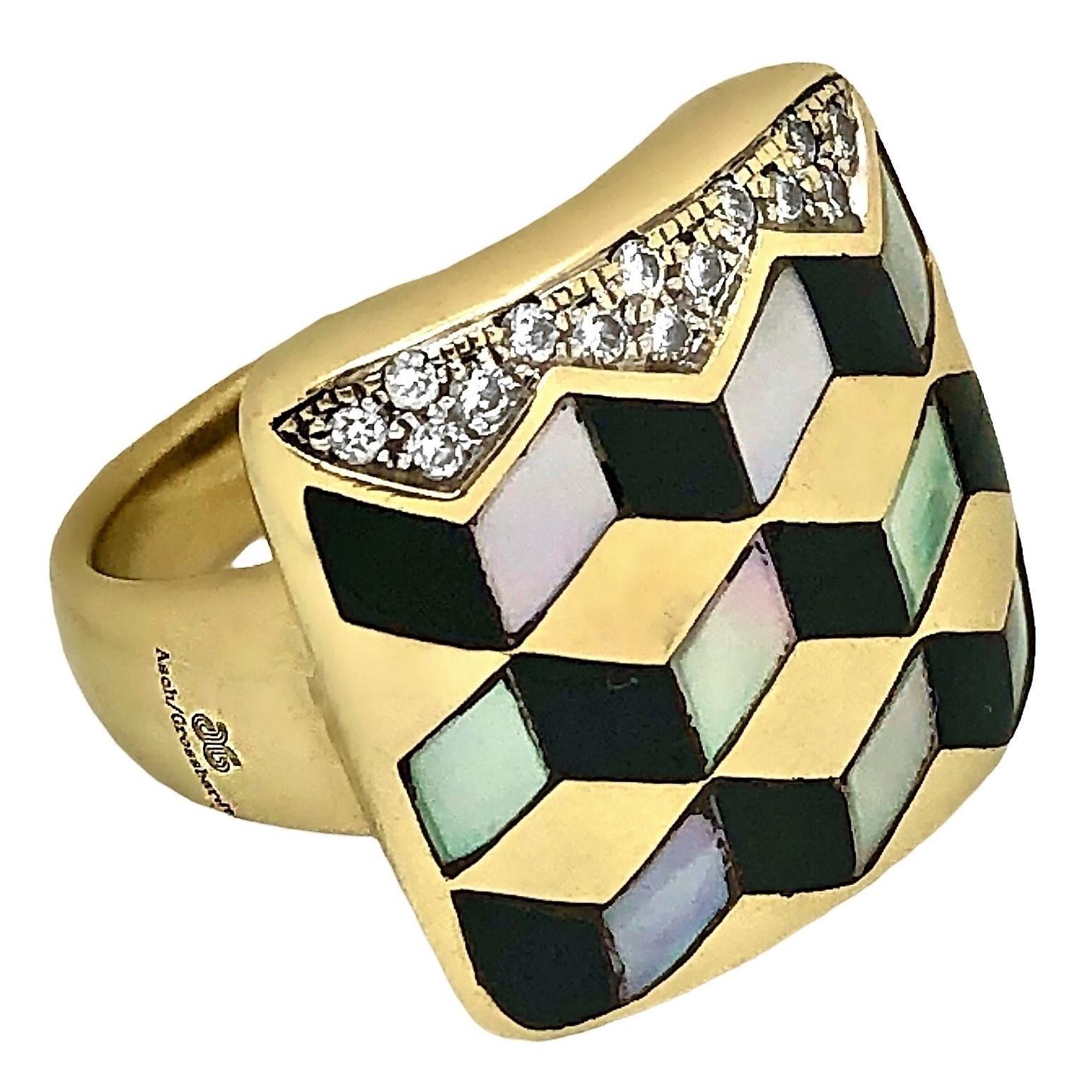 This intricately crafted Asch Grossbardt 14K yellow gold, diamond, onyx and Mother of Pearl fashion ring creates the optical  illusion of being three dimensional. As with all Grossbardt pieces, the precious stone inlay work is the very finest and,
