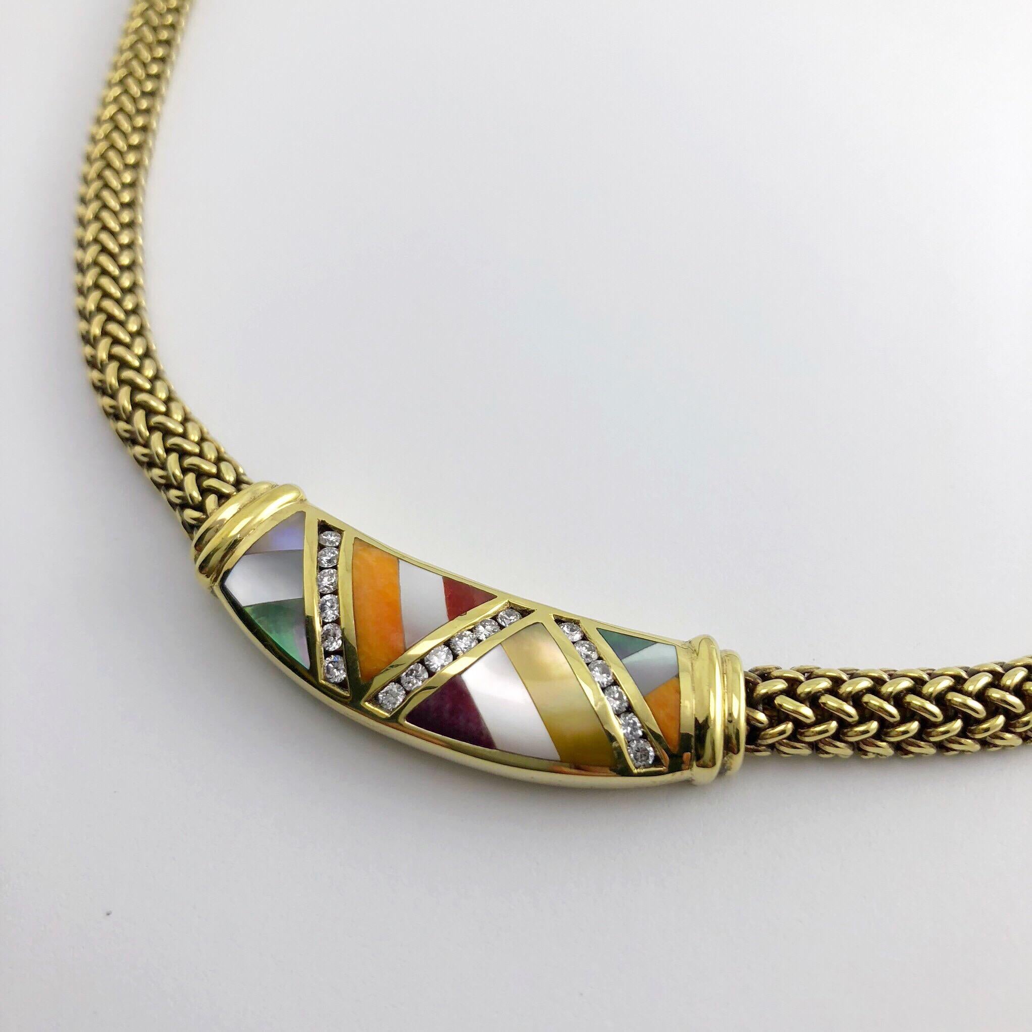 This Fun, colorful, and wearable Asch Grossbardt piece features a 17 inch, 18 karat yellow gold mesh chain which has a center section set with 18 round brilliant diamonds weighing .45 carats. The centerpiece is inlaid with geometric shapes of spiny
