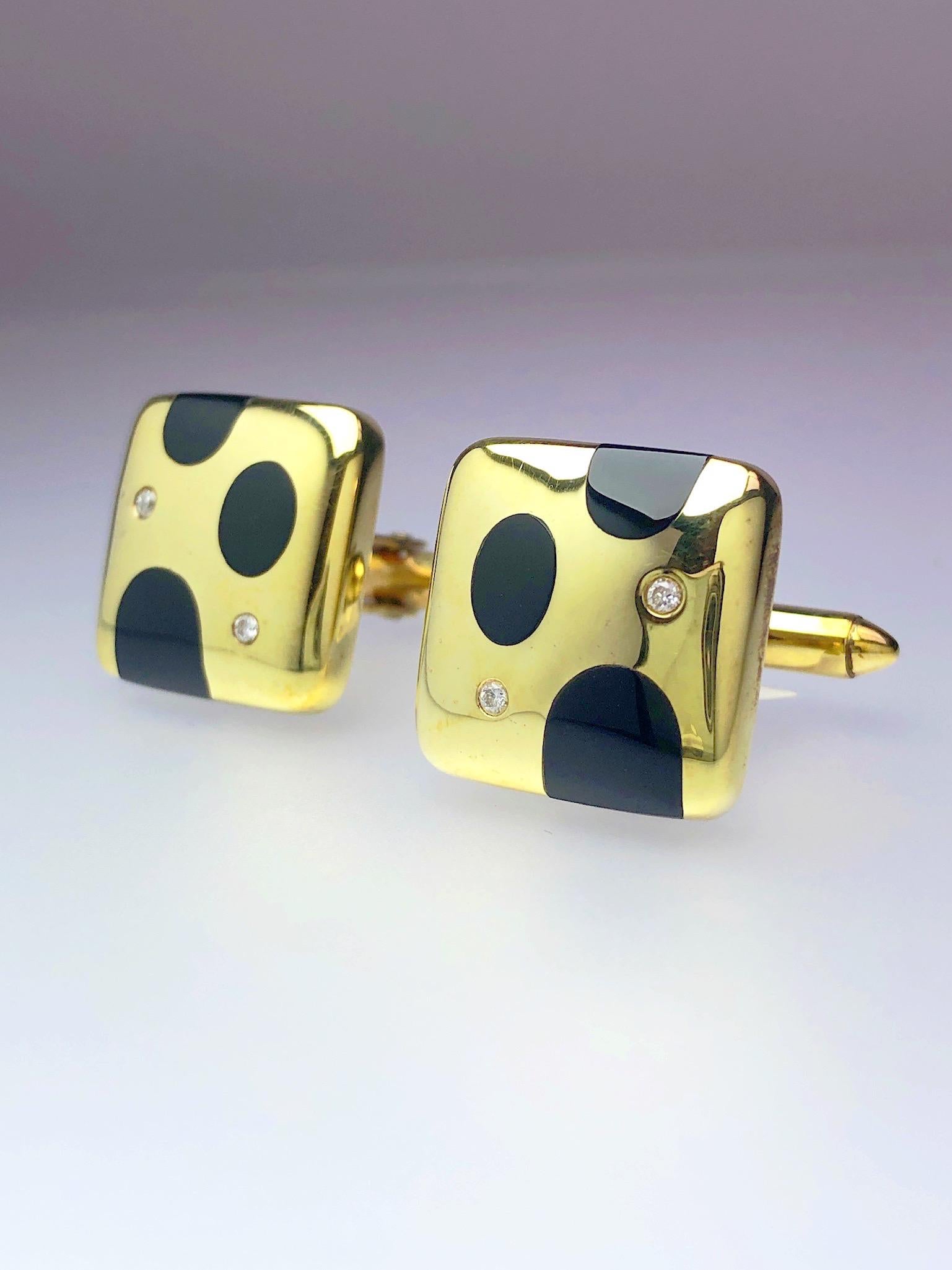 High polished 18 karat yellow gold cushion shaped cufflinks set with black onyx polka dots with diamond accents. The cufflinks measure approximately 1/2