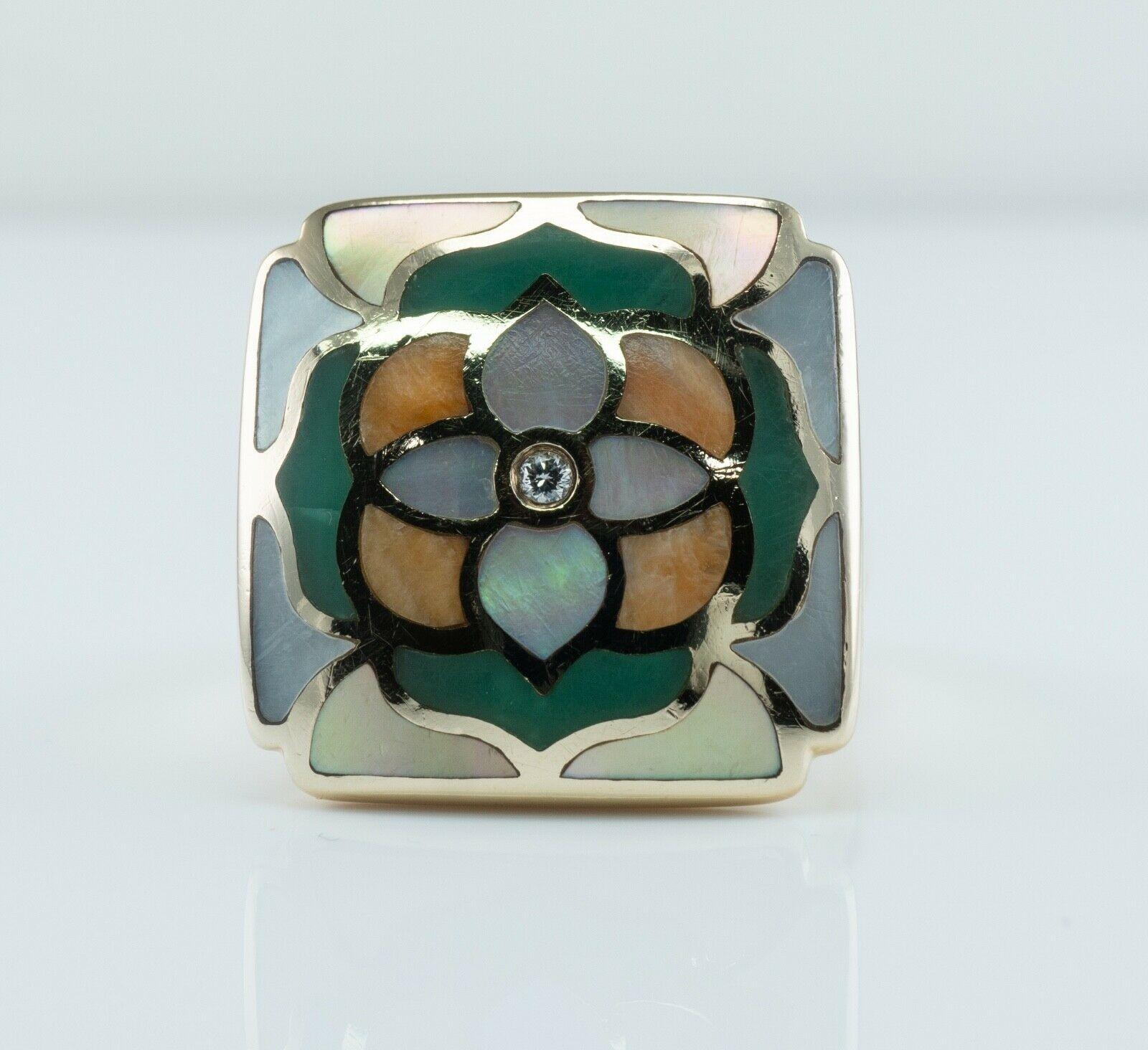 This authentic Asch Grossbardt ring is finely crafted in solid 14K Yellow gold and set with inlaid Mother of pearl and diamond.
The diamond in the center is .03 carat of VS2 clarity and H color.
Inlaid mother of pearl panels are set in the Mandala