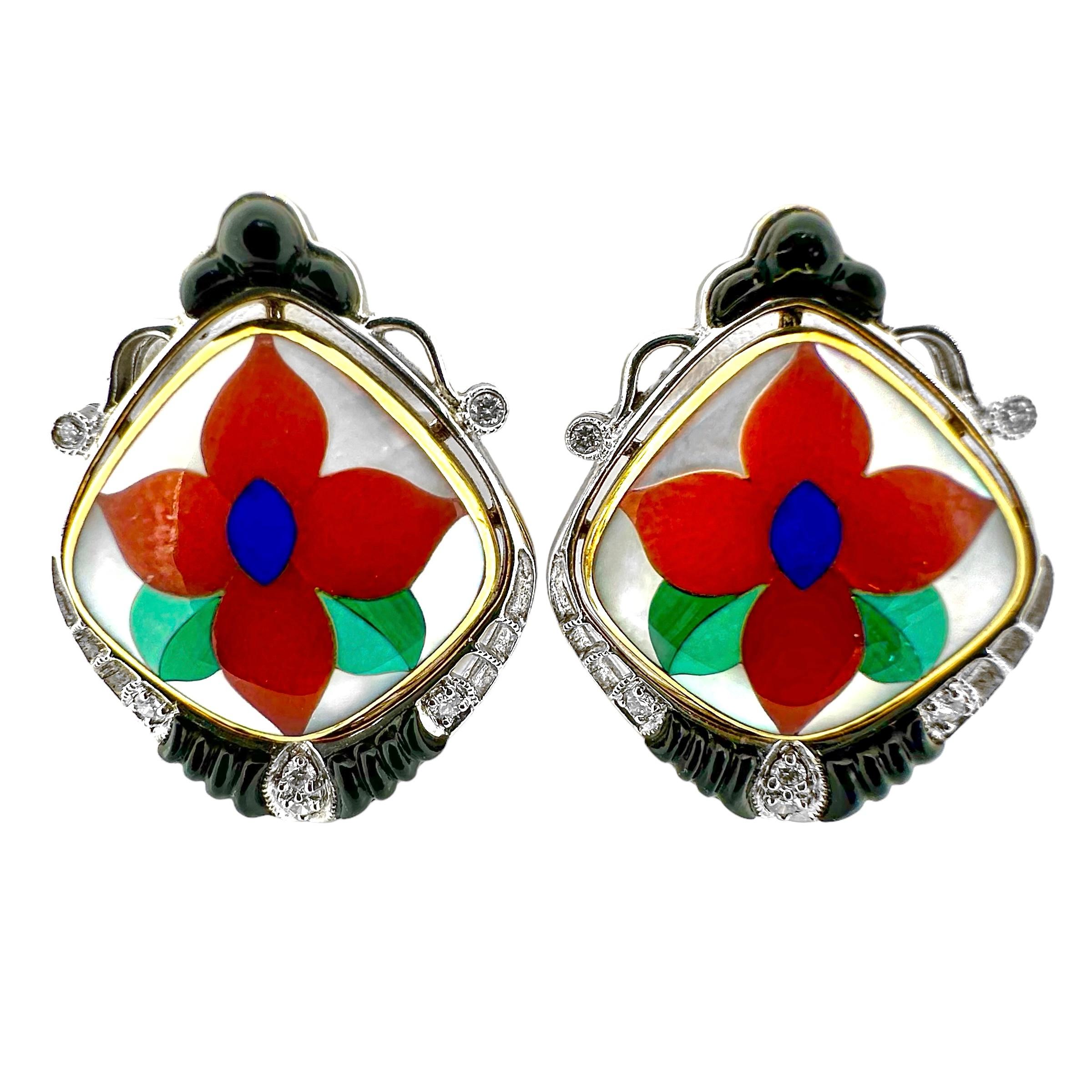 These two-tone Asch Grossbardt earrings feature the precision lapidary work that made the company famous. At the heart of each earring, set in a yellow gold frame, is a flower with a lapis lazuli center, carnelian petals, and leaves comprised of