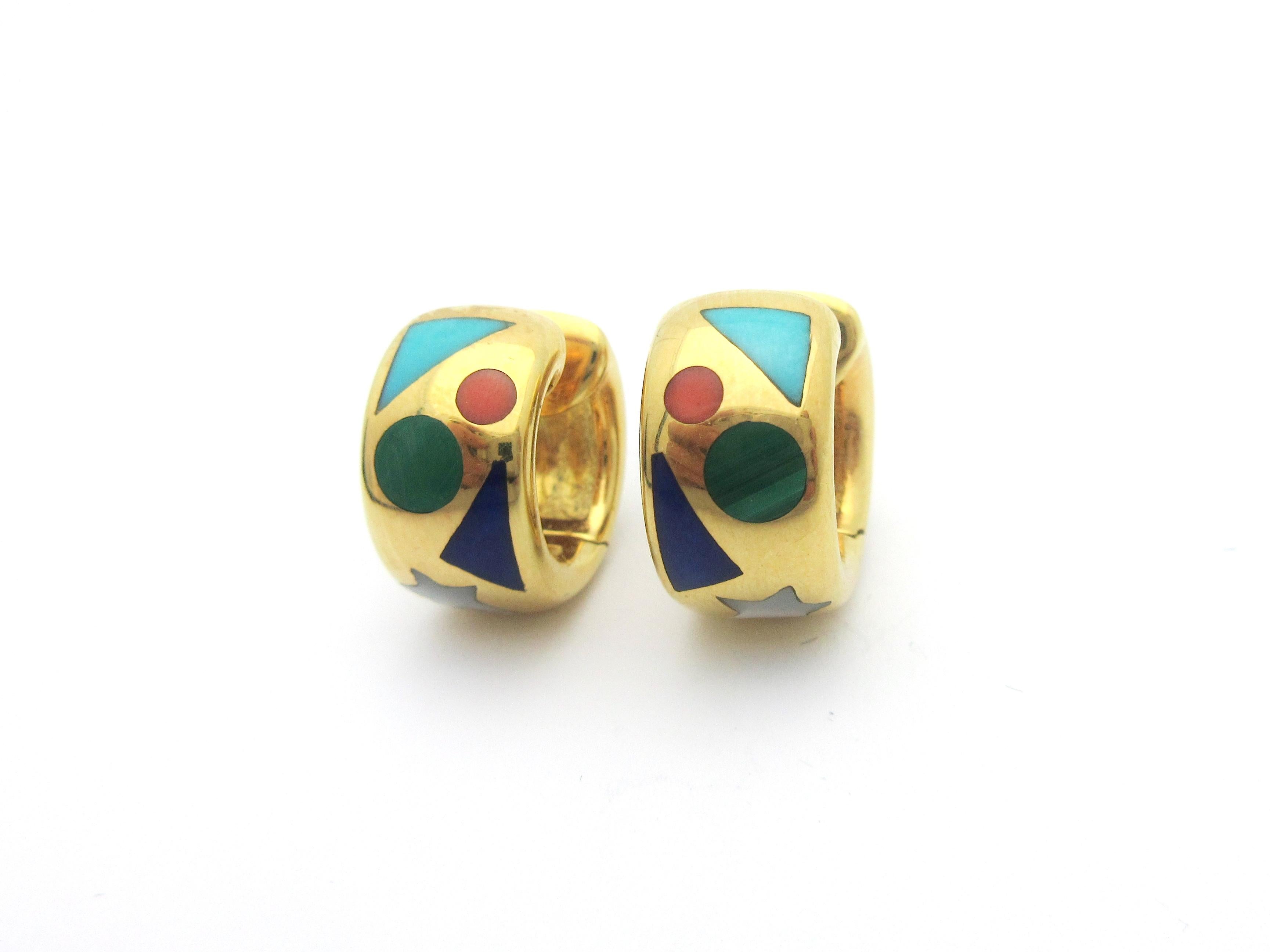 This beautiful pair of huggie hoop earrings by Asch Grossbardt were made from 18k yellow gold and feature geometric gemstone inlay.  The stones are turquoise, malachite, lapis lazuli, coral, and mother of pearl.  The earrings measure approximately