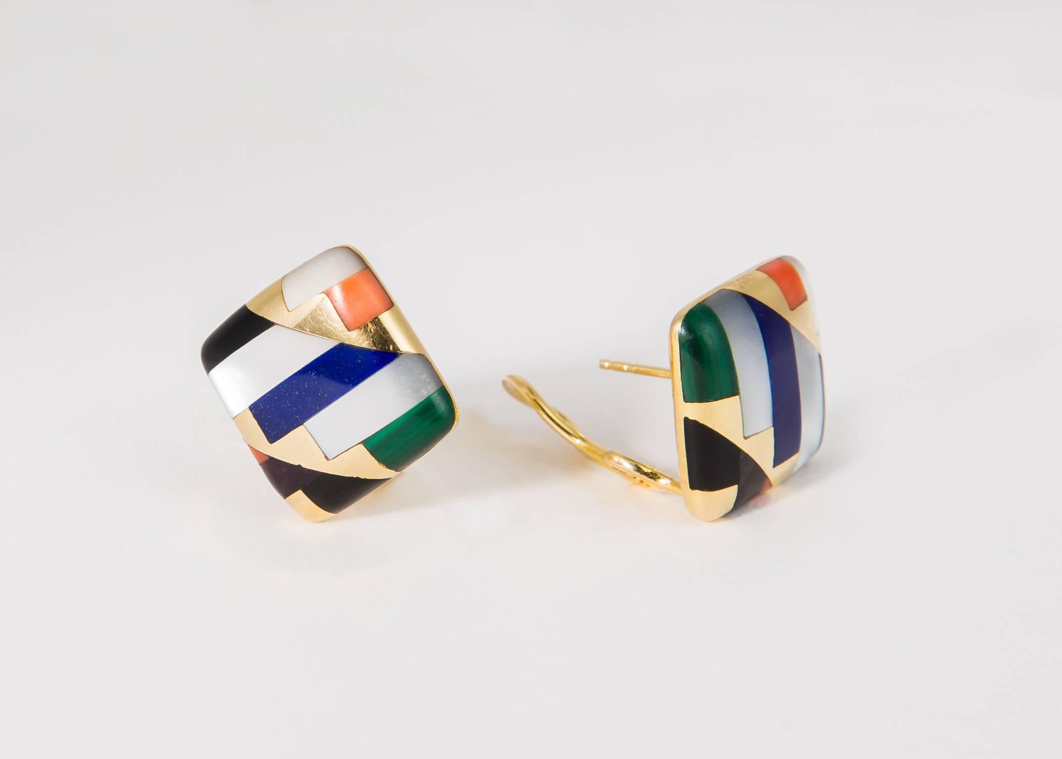 Recognizable Asch Grossbardt inlaid wearable art. A beautiful color combination of blue lapis, green malachite, orange coral with black onyx and white mother of pearl create a chic classic design. An easy to wear 3/4's of an inch. 