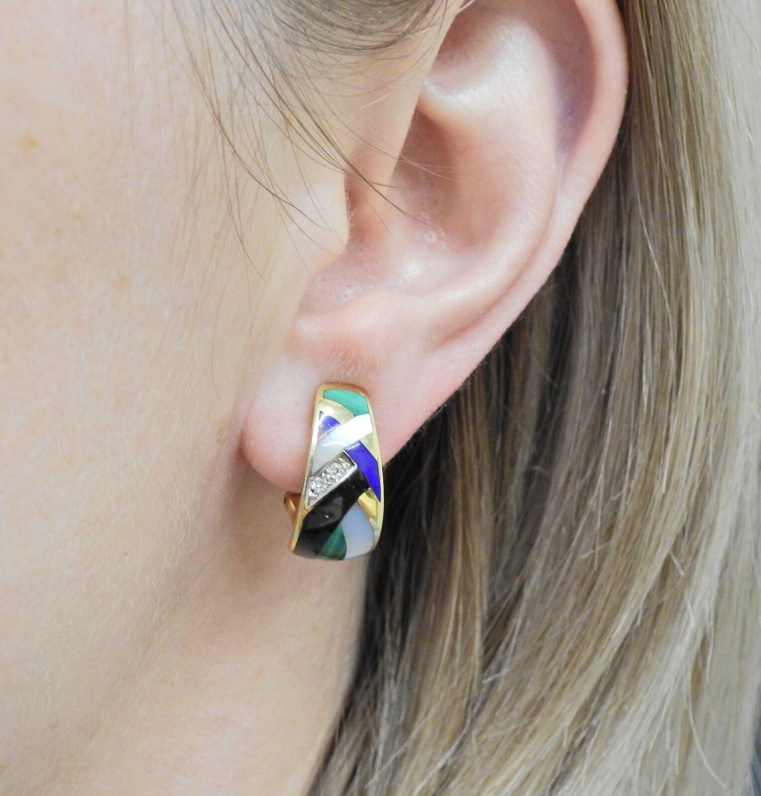 A pair of 14k yellow gold earrings set with mother-of-pearl, malachite, onyx, lapis, coral and diamonds - approx. 0.04ctw.
DIMENSIONS: Earrings 21mm x 10mm. 8.9 grams.