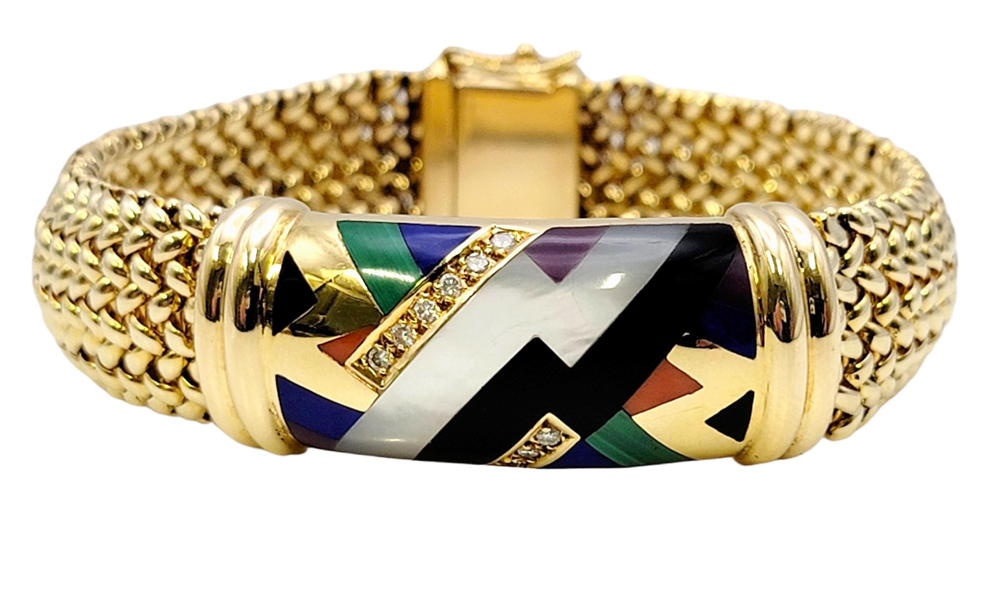 Adorn your wrist in vibrant modern art! This gorgeous diamond and gemstone mosaic bracelet from esteemed jewelry designer, Asch Grossbardt is sure to make a bold statement.  This stunning designer bracelet features a flexible, wide mesh bracelet in