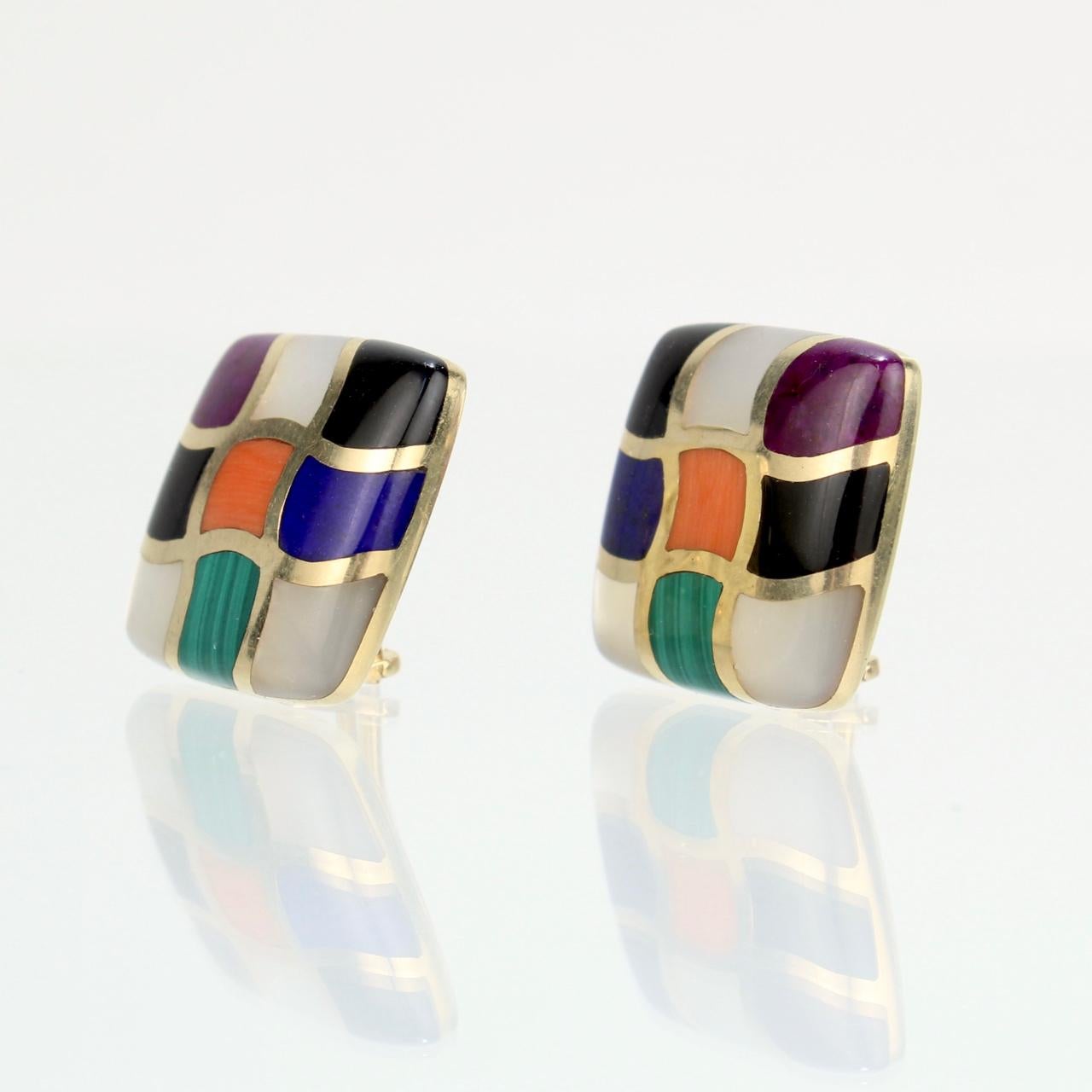 A wonderful pair of signed clip-on earrings. 

By Asch Grossbardt.

In 14k yellow gold. 

Each inlaid with lapis, coral, mother-of-pearl, onyx, and malachite and square-shaped with rounded corners.

Condition:
They are in overall good, as-pictured,