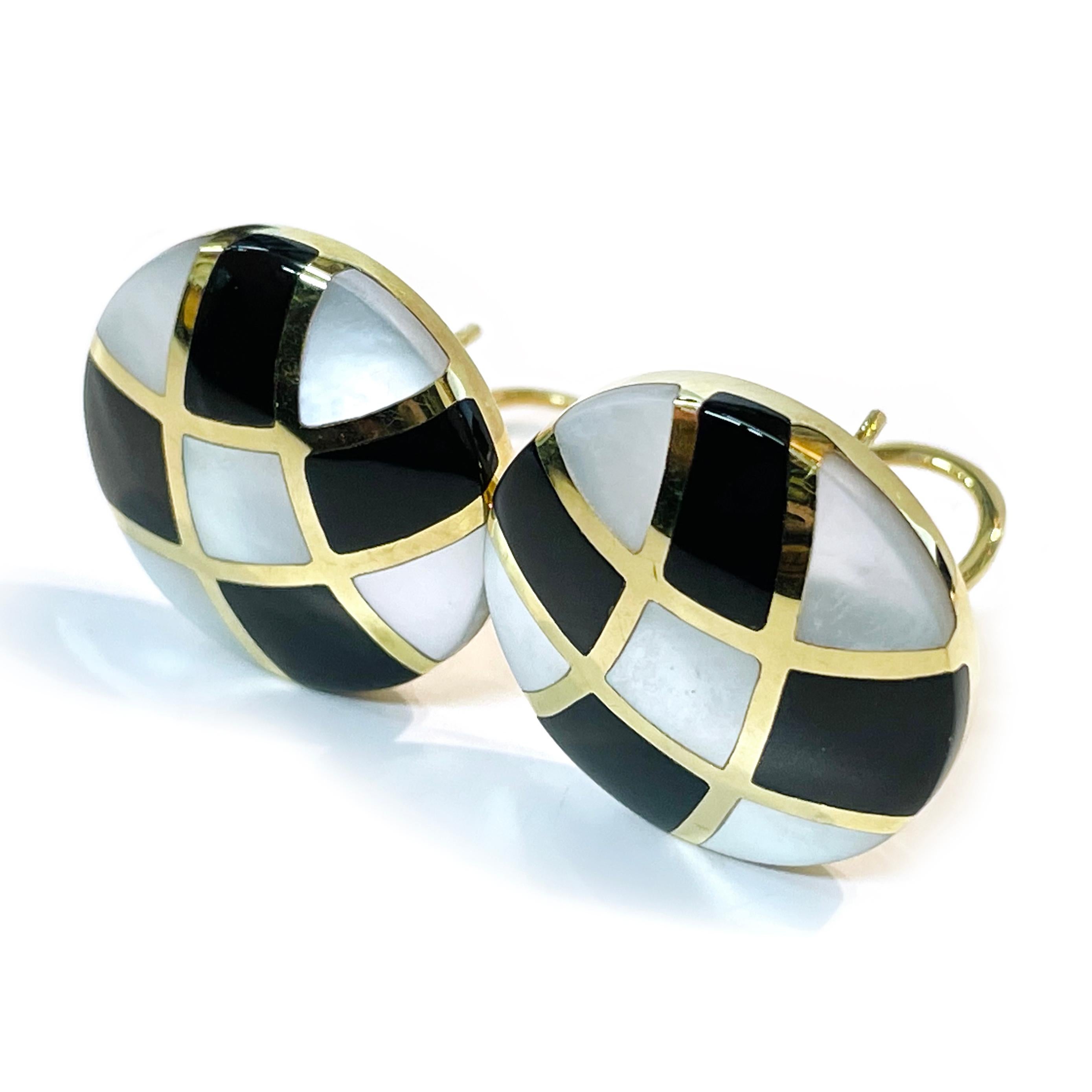 Asch/Grossbardt 14 Karat Yellow Gold Mother of Pearl Onyx Earrings. The earrings feature a curved checkered pattern of mother of pearl and onyx with swooshes of gold. The earrings have a post and Omega clip back. Each earring measures 21.5mm in