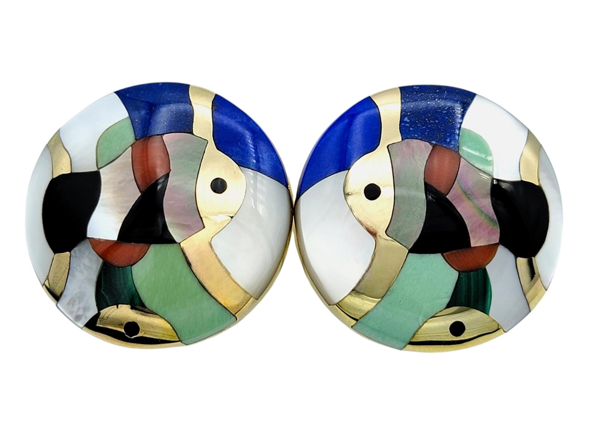 Unveil a world of artistry and elegance with this exquisite pair of omega back earrings by the renowned designer, Asch Grossbardt. These earrings are more than just jewelry; they are a celebration of craftsmanship and creative expression, where each