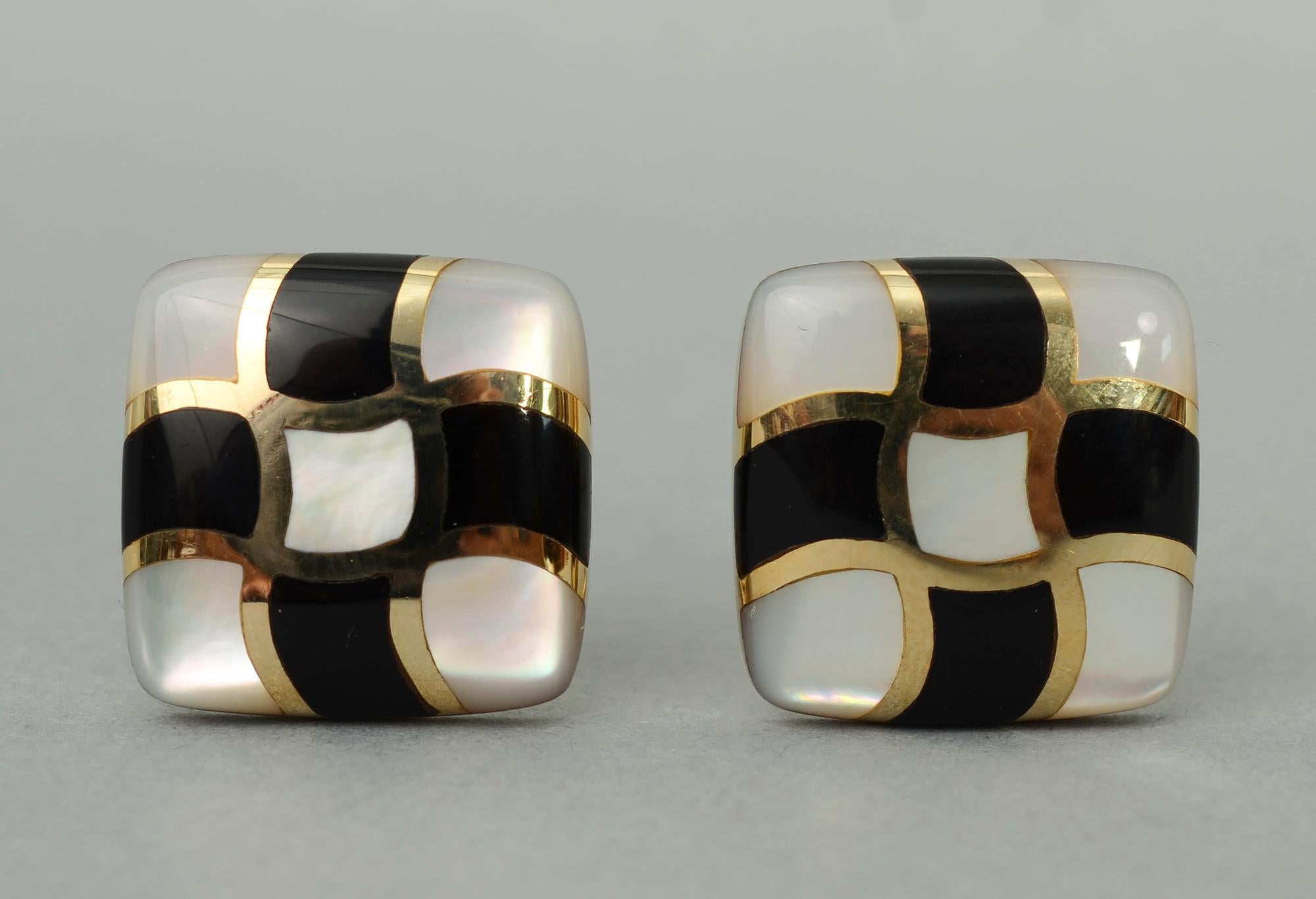 Chic black and white earrings by Asch Grossbardt with onyx and mother of pearl. Dividing the nine squares with curved gold banding makes them especially jazzy. The earrings measure 13/16