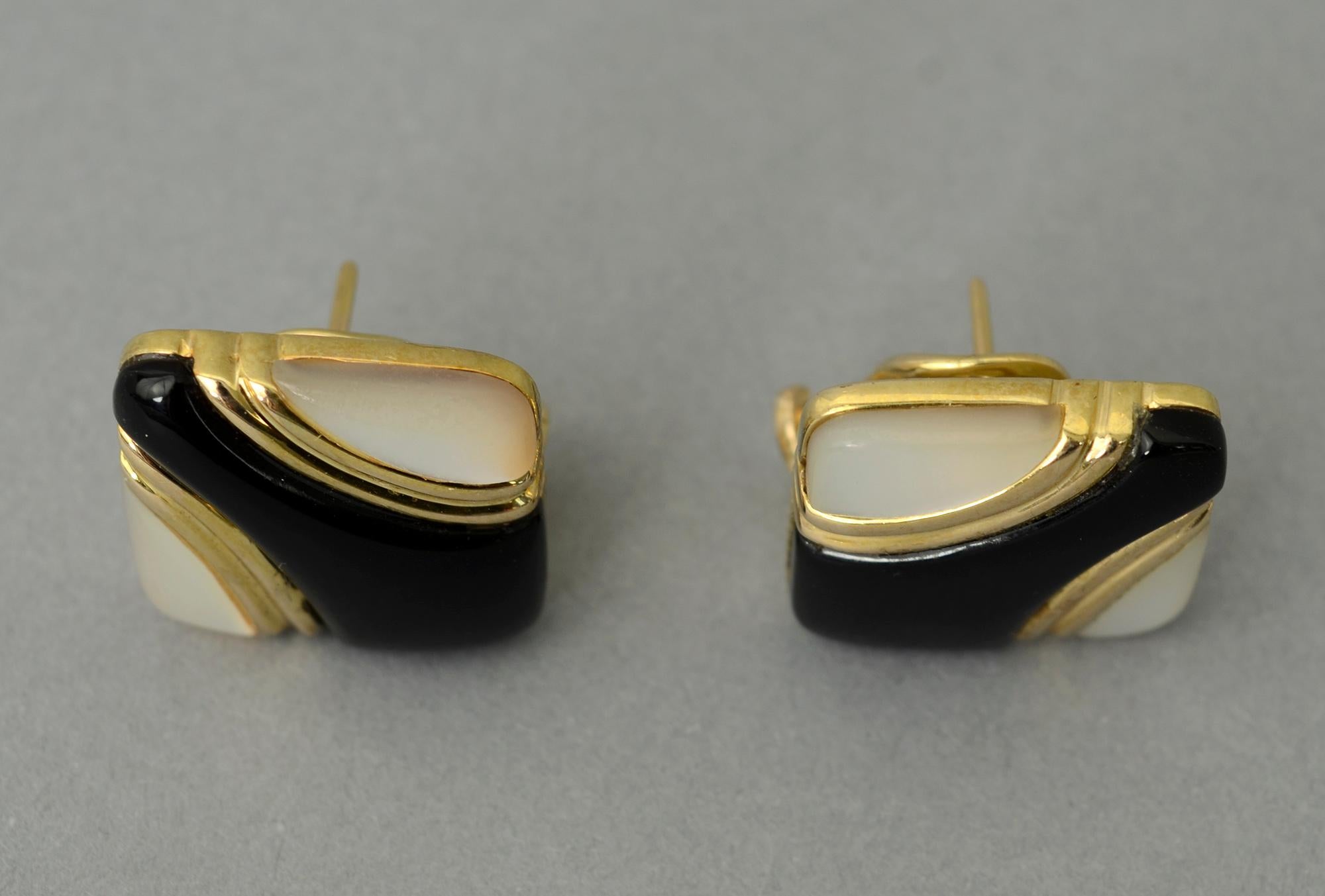 Wonderful dark and light design of inlaid stones for which Asch Grossbardt is well known. The stones are black onyx and mother of pearl set in 14 karat gold. The earrings are 3/4 inch square. Backs are posts and clips.