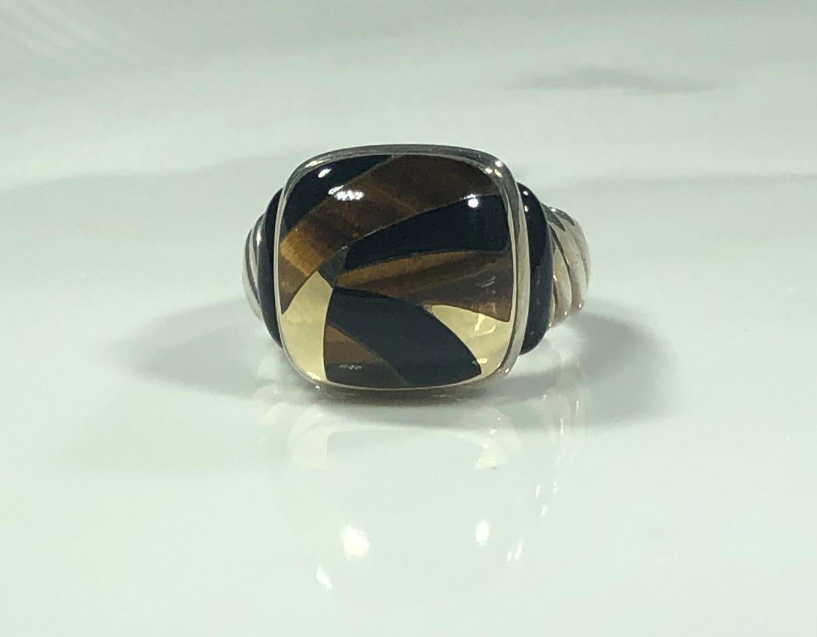 Asch Grossbardt  Sterling/18 KT Inlaid Onyx and Tiger's Eye Contemporary Ring. This piece is created in 18 karat yellow gold and 925 sterling silver. Gorgeous inlaid tiger eye and onyx design. This is a new piece not pre-owned. finger size 7. A