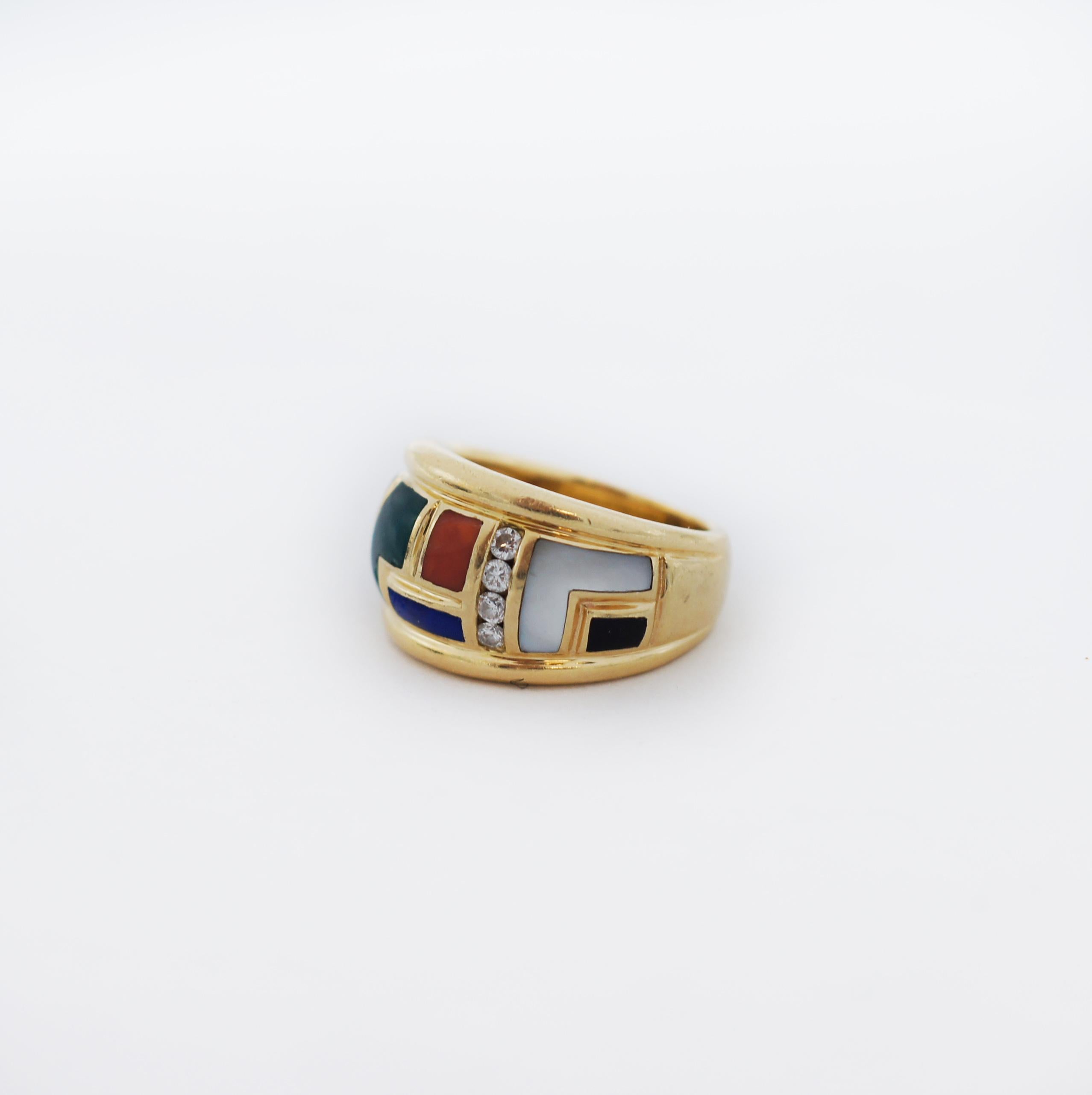 Wide band ring is inlaid to front with a mosaic of calibré cut gemstones
Featuring ultramarine lapis lazuli, green chalcedony, white mother-of-pearl, black onyx, and orange coral
Channel of round brilliant cut diamonds weigh in total approximately