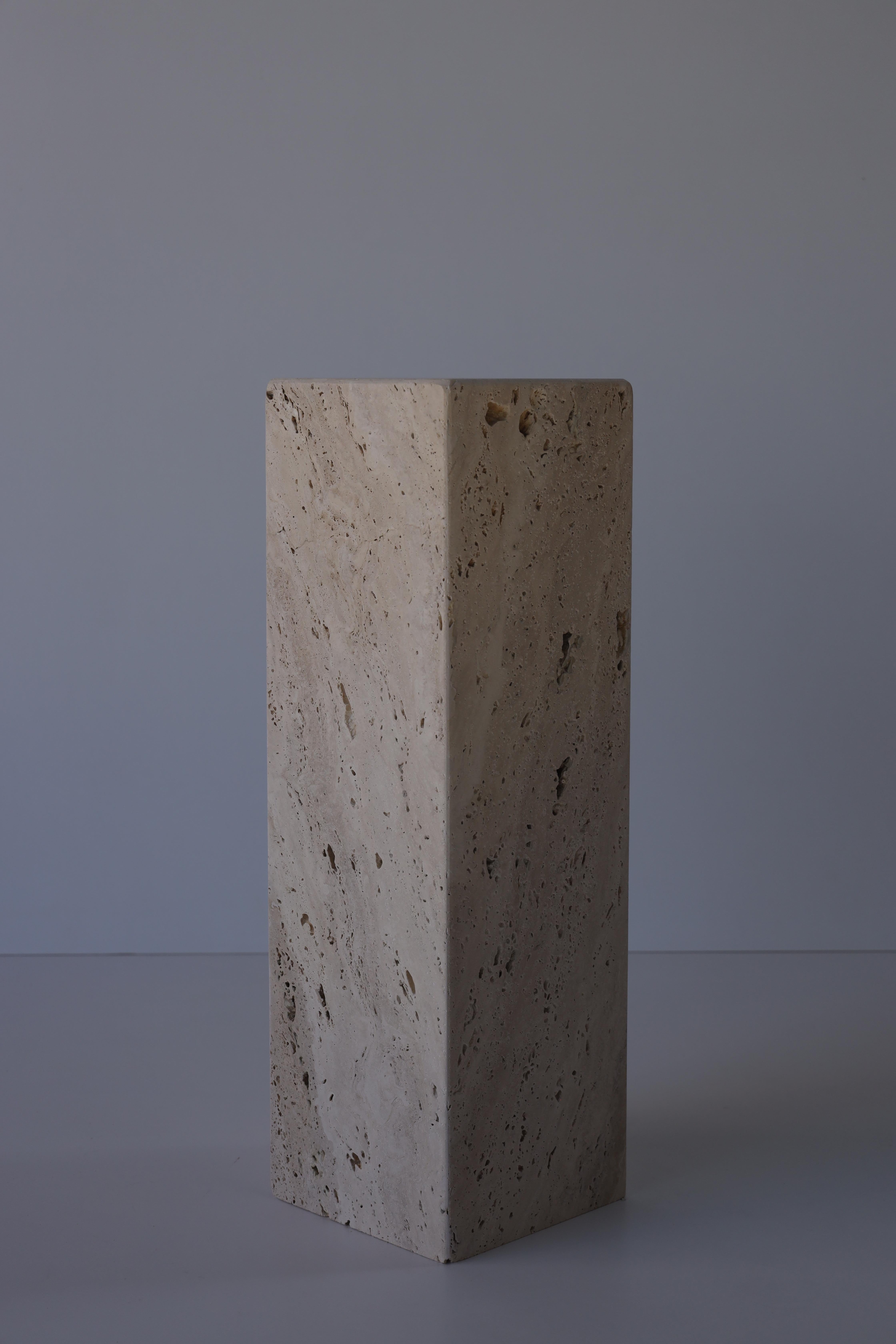 The Ascolane Travertine pedestal is a stunning and elegant piece of natural stone craftsmanship that embodies both timeless beauty and functional design. Carved from exquisite Ascolane Travertine, a distinct variety of travertine known for its warm,