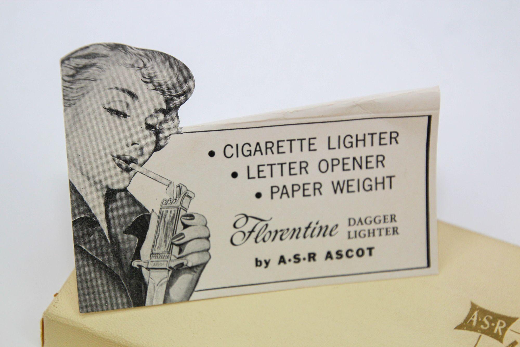 Ascot Florentine Dagger Lighter Letter Opener Paper Weight.
This is a very unique lighter letter opener comes in original box and sheath.
America, 1952, made by the American Safety Razor Co.
Vintage Dagger-form letter opener with a lighter at the