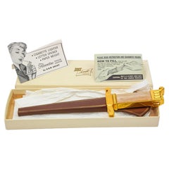 Ascot Florentine Dolch-Feuerzeug Brieföffner Briefbeschwerer Gold und Brown 1950er Jahre