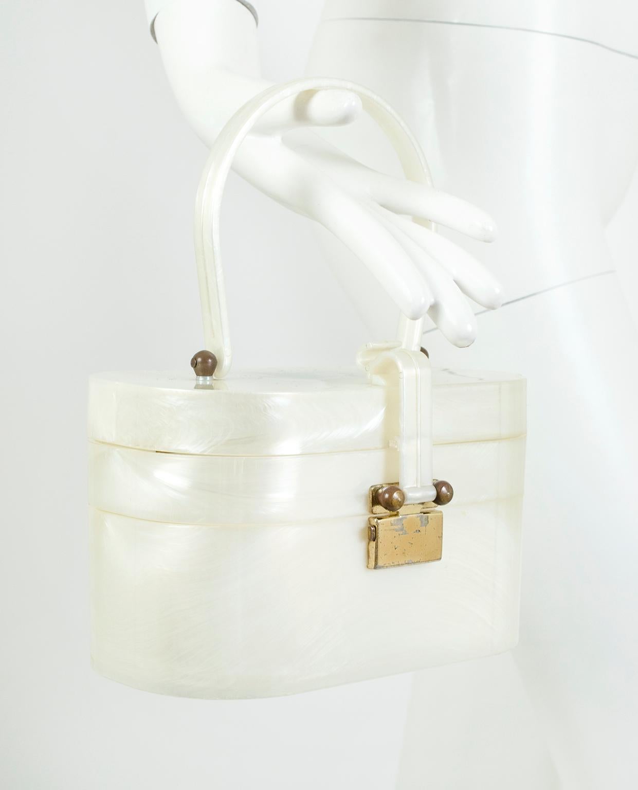 Post-war suburban gold, this nostalgic box purse is a beautiful, functional conversation piece thanks to its sizeable interior and clever double decker design. The Lucite lid flips open to reveal a tray, beneath which is hidden a second