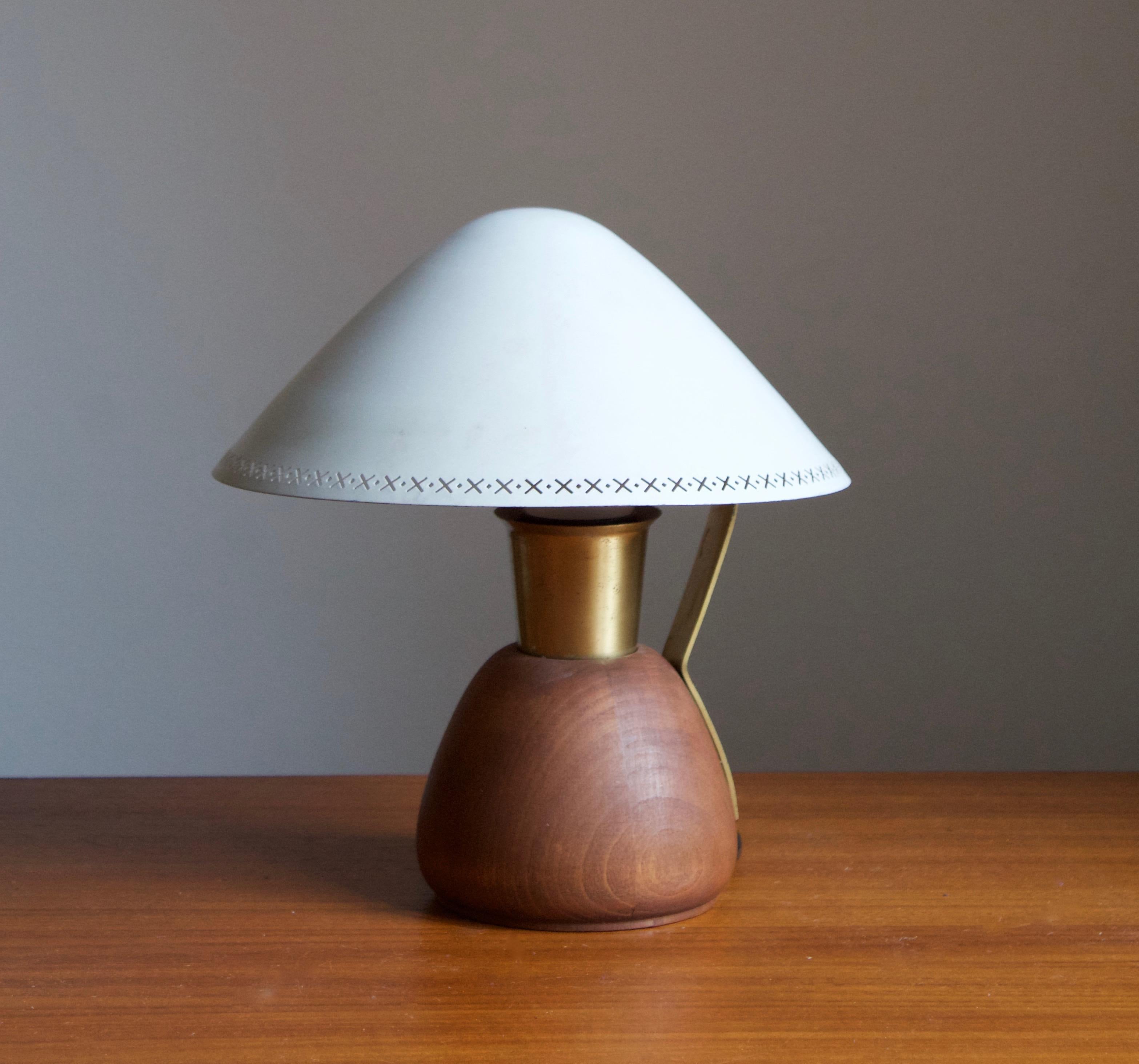 A modernist table lamp, designed and produced by ASEA, Sweden, 1940s.

Features lacquered metal, brass and solid teak.
        