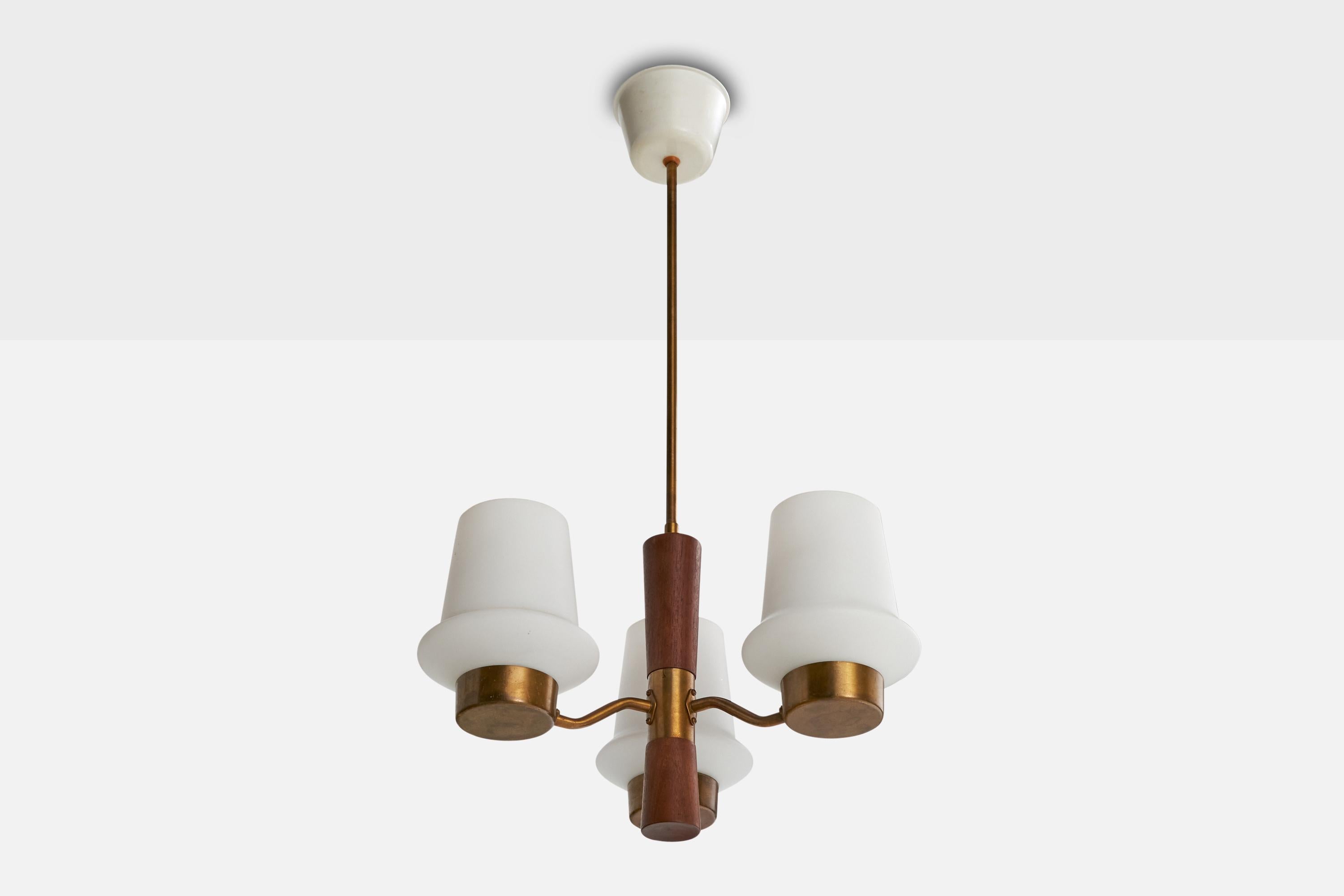 A brass, teak and white opaline glass chandelier designed and produced in Sweden, c. 1950s.

Overall Dimensions (inches): 29” H x  14” Diameter

Dimensions of Canopy:  2.75” H x 4.5” diameter

Stem length: 15.25” H

Bulb Specifications: