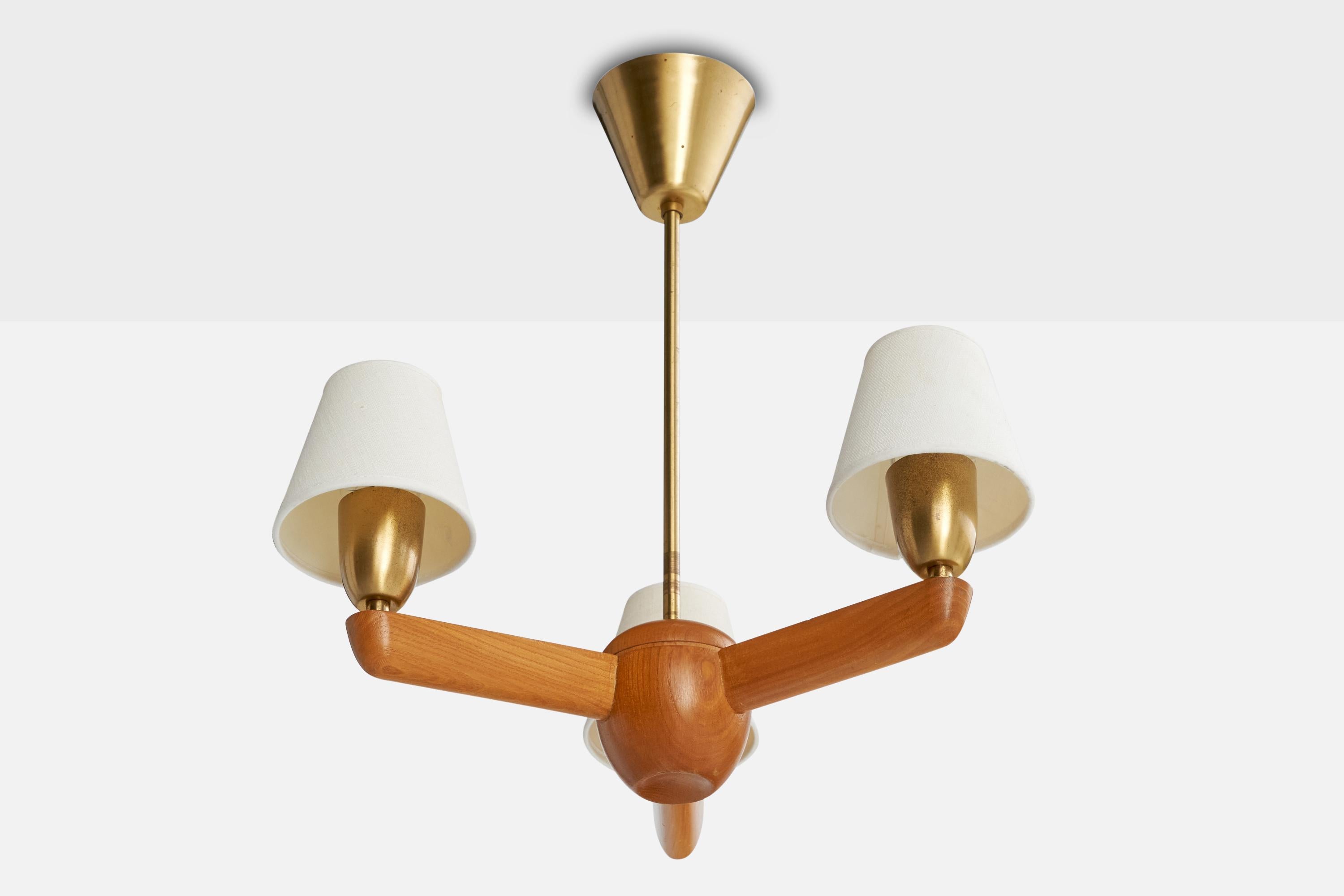 An oak, brass and white fabric chandelier designed and produced by ASEA, Sweden, c. 1940s.

Overall Dimensions (inches): 18.75” H x  16” Diameter

Dimensions of Canopy:  3.25” H x 4” diameter

Stem length: 11” H

Bulb Specifications: E-26 

Number