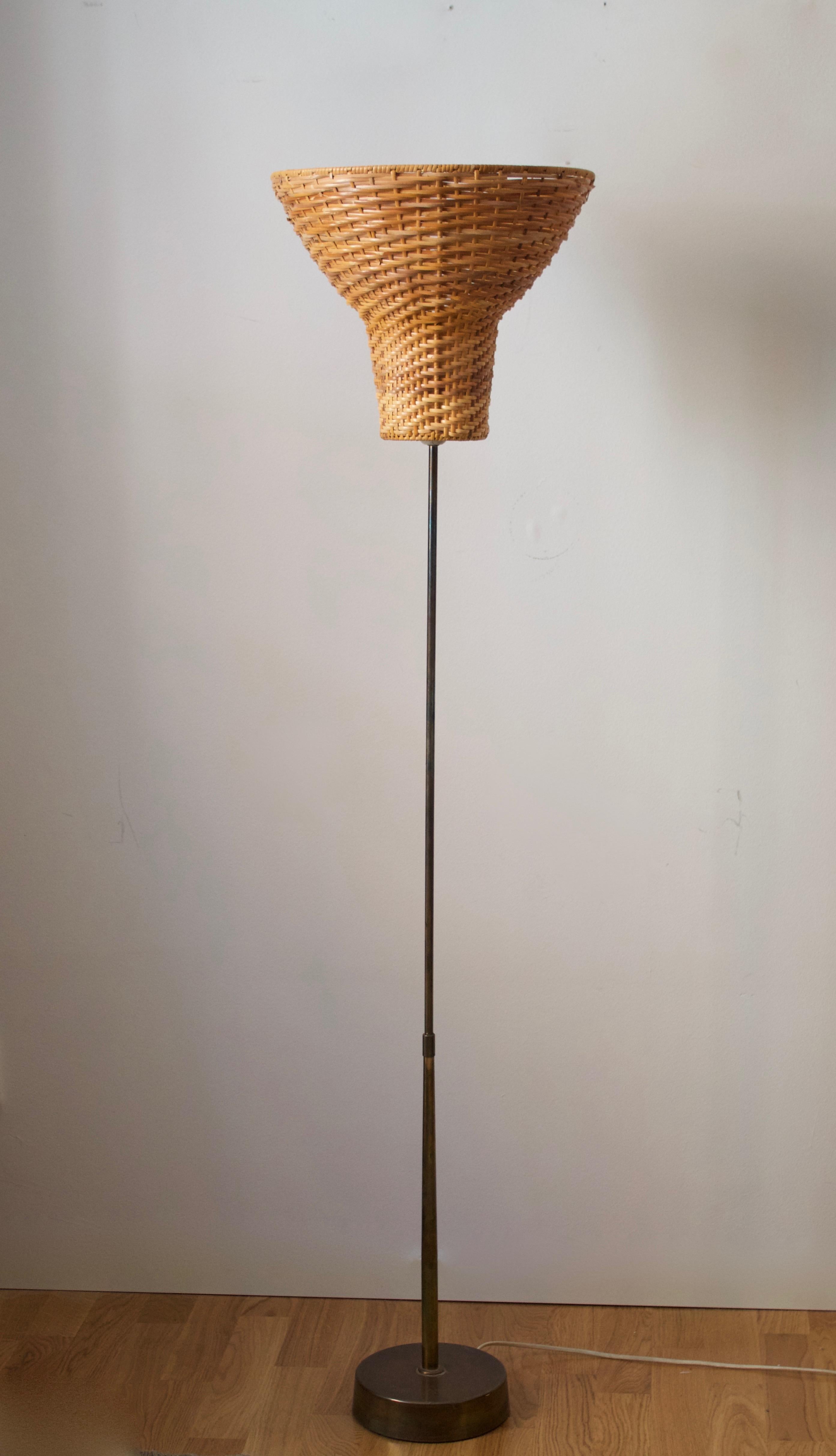 A small floor lamp, produced by ASEA, 1950s. 

Brass, assorted vintage rattan lampshade sourced in Swedish secondary market.

Stated dimensions include illustrated lampshade.

Other designers of the period include Josef Frank, Hans Bergström,