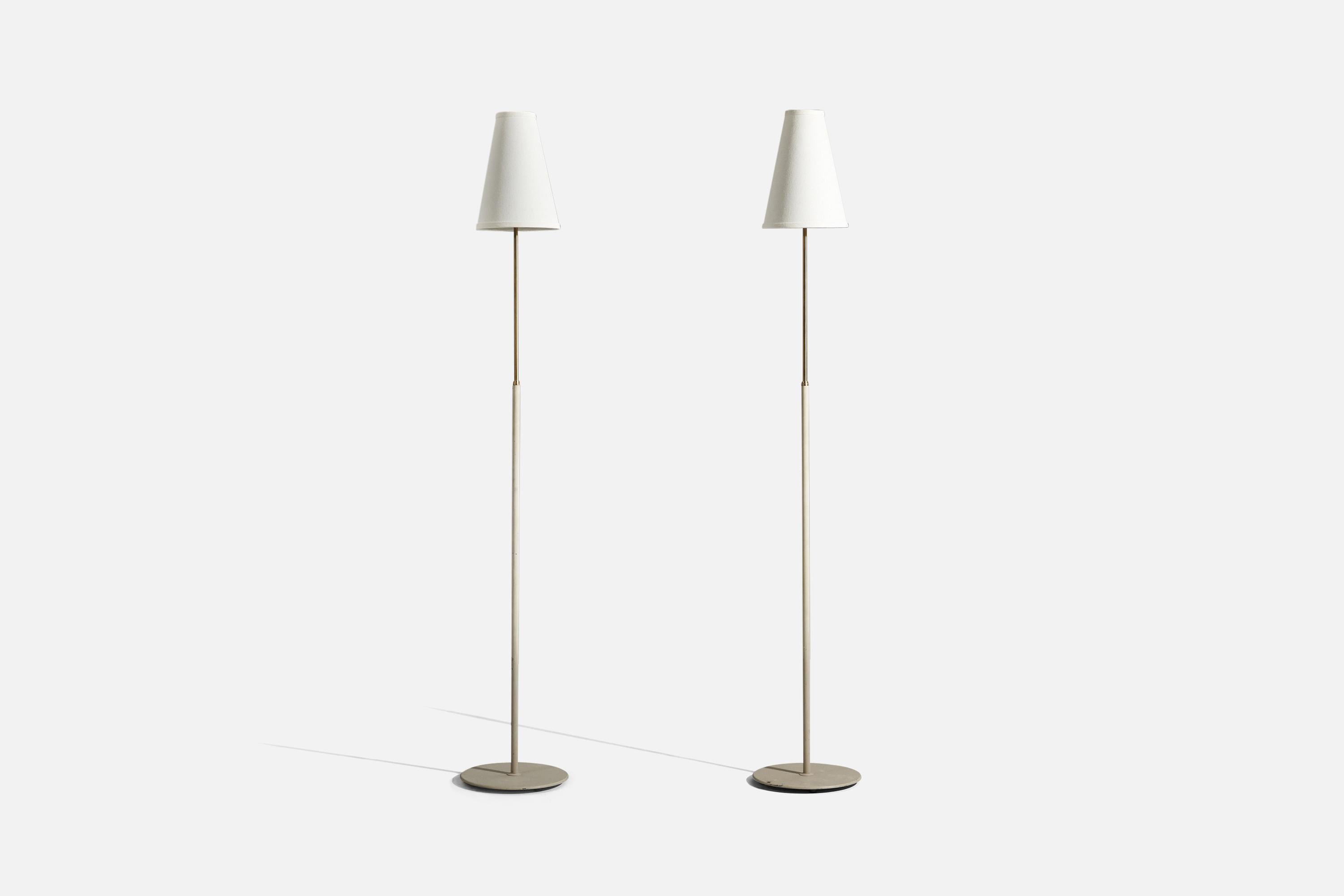 A pair of brass and lacquered metal floor lamps, designed and produced by ASEA, 1970s. 

Sold with lampshades.
Dimensions of floor Lamp (inches) : 52.25 x 9.5 x 9.5 (H x W x D)
Dimensions of shade (inches) : 3.25 x 7.25 x 10 (T x B x