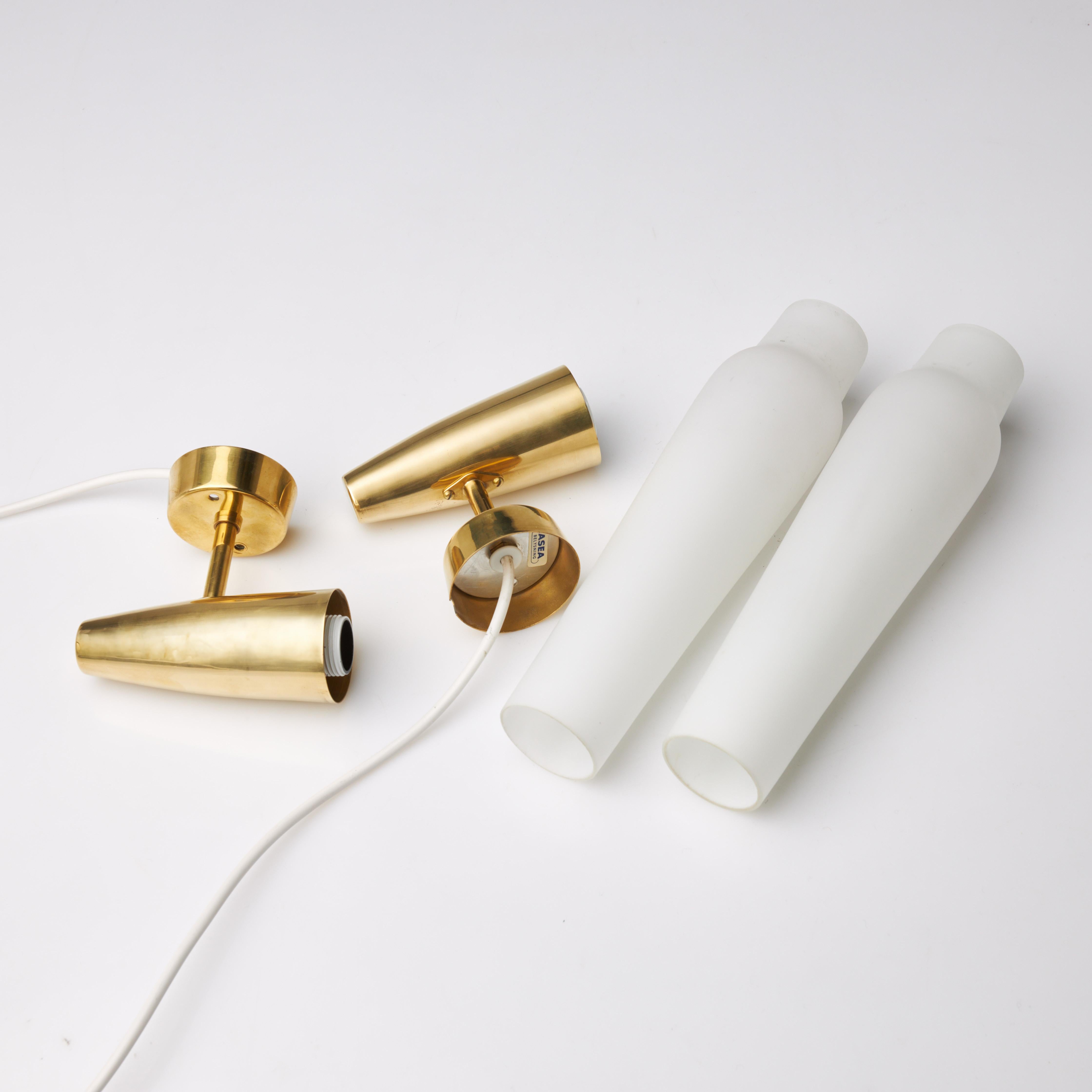 Swedish Asea wall lights a pair in brass and glass Sweden 1960 For Sale