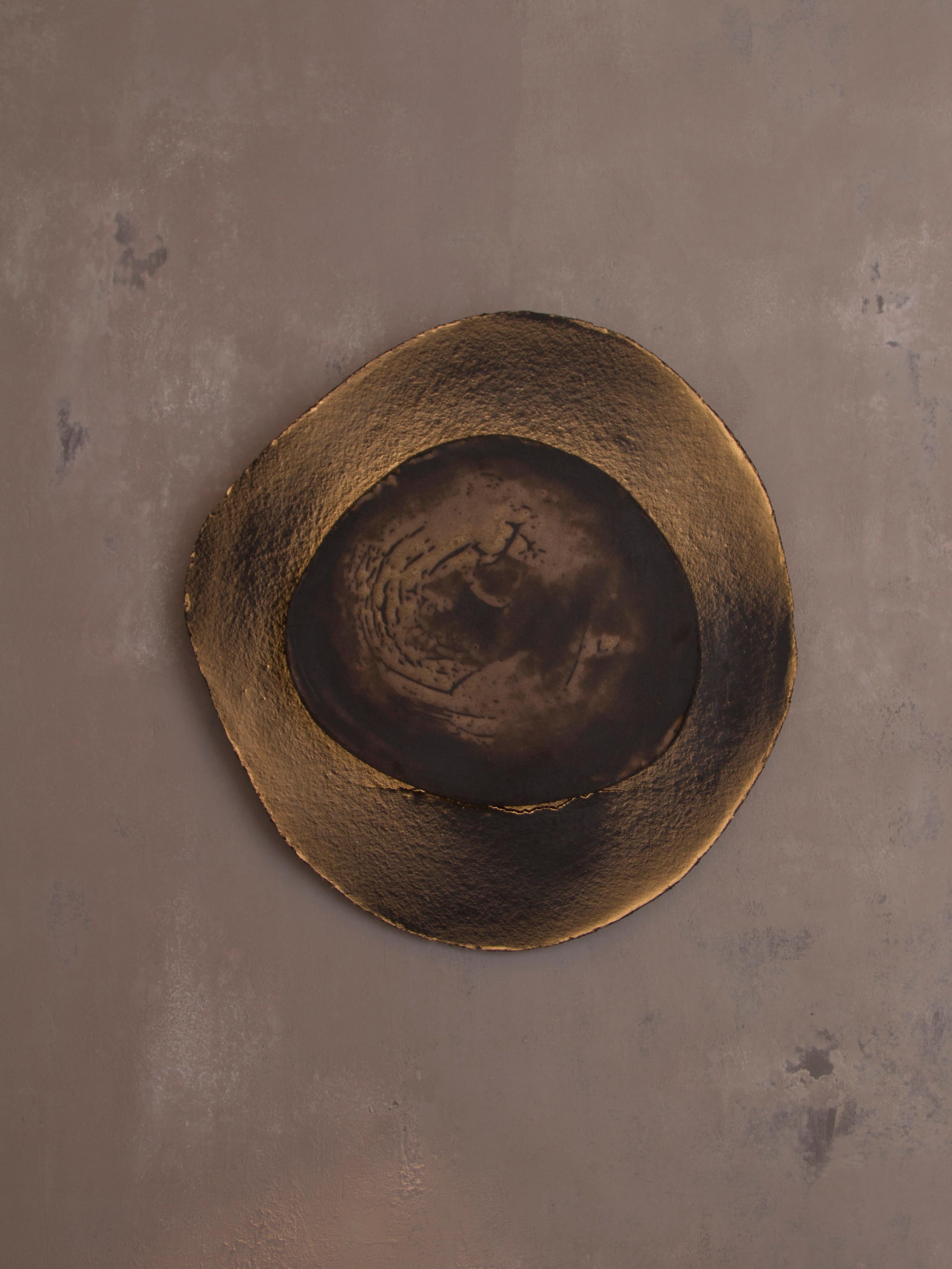 Ash #7 wall light by Margaux Leycuras
One of a Kind, Signed and numbered
Dimensions: D 6 x W 56 x H 54 cm 
Material: Ceramic, black stoneware with patinated gold enamel.
The piece is signed, numbered and delivered with a certificate of
