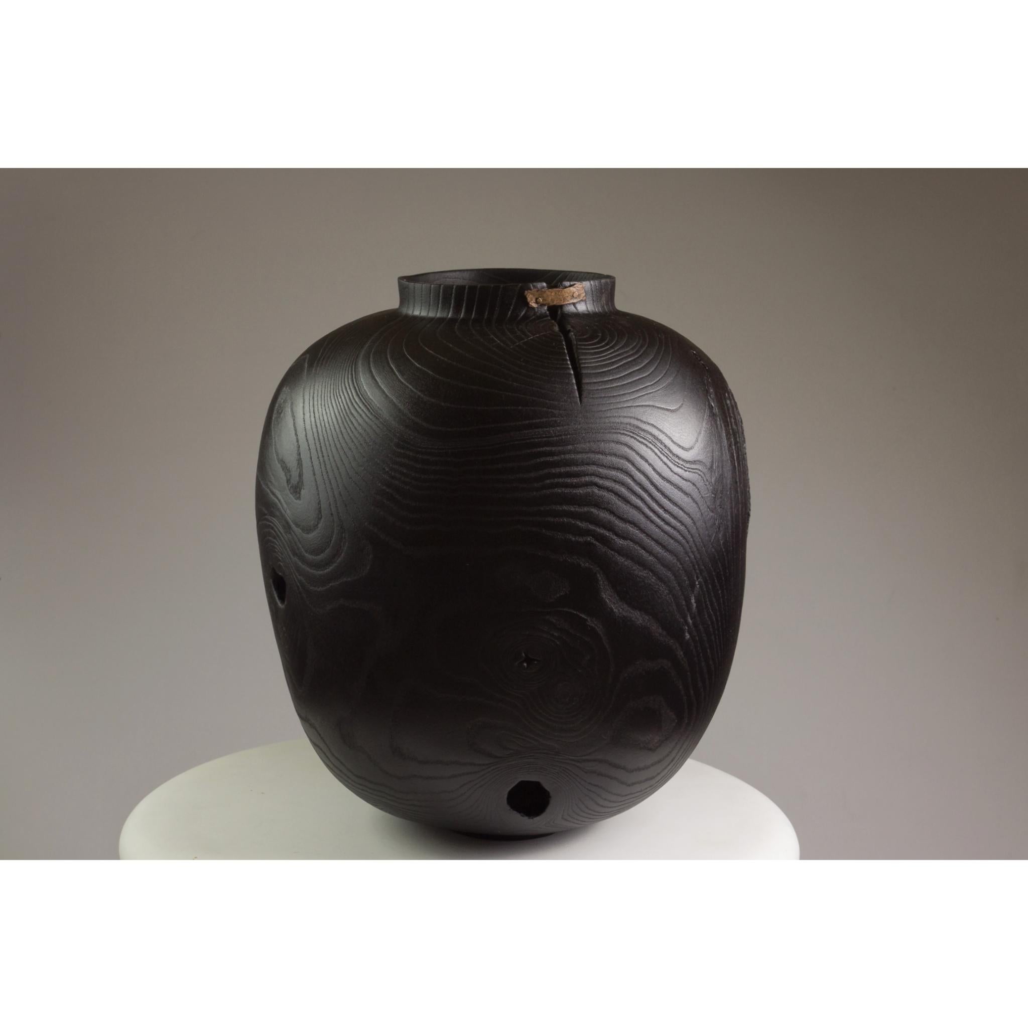 Ash and copper vase by Vlad Droz.
Dimensions: ?29 x H30 cm.
Materials: Ash and Copper.
One of a kind. 

Ash and Copper Vase by Russian Vlad Droz. This vase is greenturned, charred and sandblasted.

Vlad Droz
