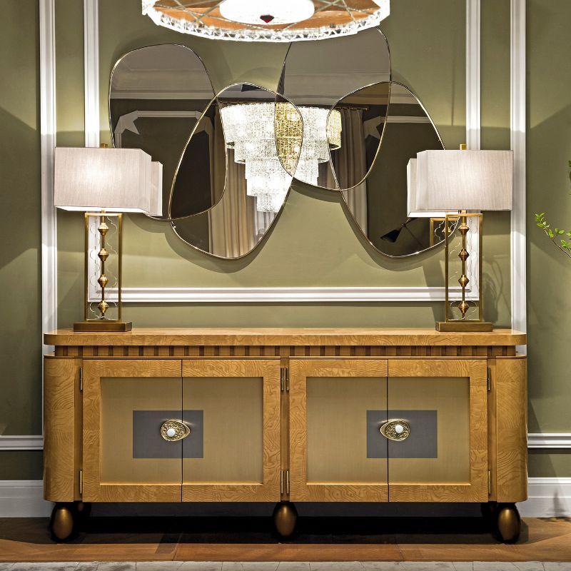 A stupendous sideboard deftly handcrafted of high-quality materials following traditional methods, this gorgeous sideboard features two steel and brass doors enriched with marble details. The whole piece is elegantly adorned with ash burl inlays.
