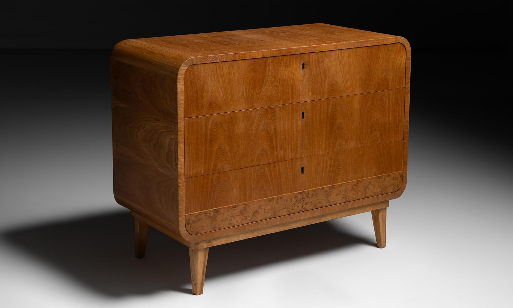 Ash & Burr Cabinet / Chest of Drawers.

England circa 1950

Solid pine frame with decorative Ash and Burr veneer. Rectangular chest with curved edges, inset drawers, and splayed legs.