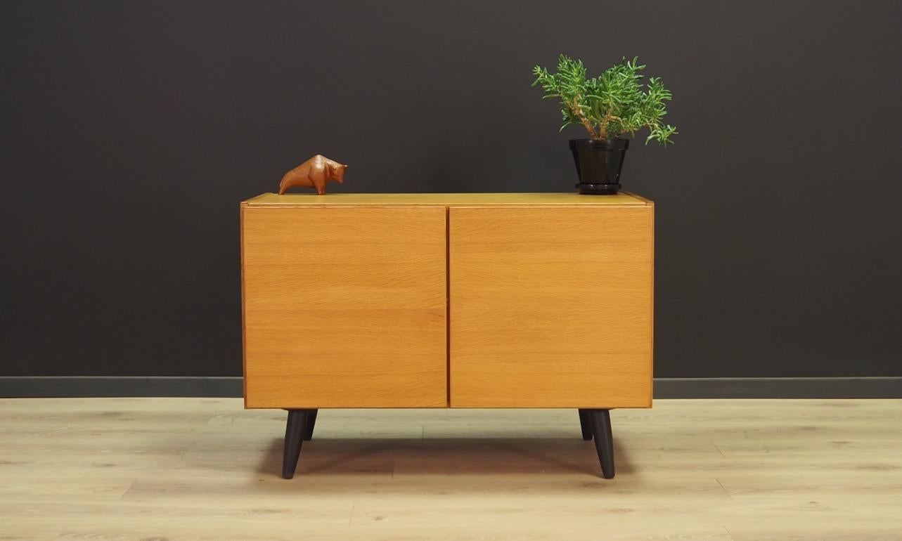 Classic cabinet from the 1960s-1970s, minimalistic form, Danish design. Surface veneered with ash. Inside two shelves with adjustable height. Maintained in good condition (minor bruises and scratches) - directly for use.

Dimensions: Height 62 cm,