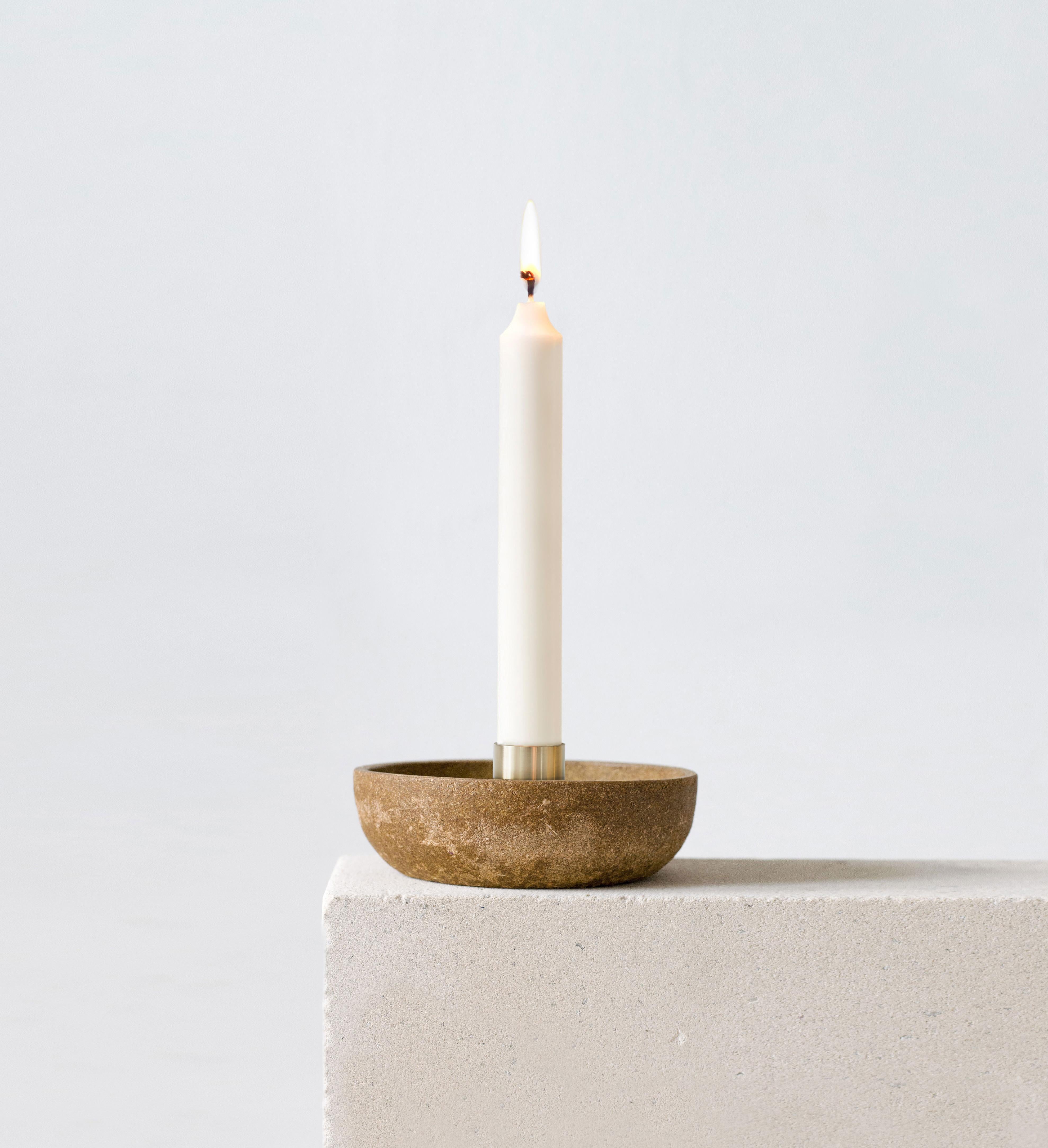 Ash candlestick holder by Evelina Kudabaite Studio
Handmade
Materials: Ash, brass
Dimensions: H 45 mm x D 105 mm
Colour: Yellow/light brown
Notes: For dry use

Since 2015, product designer Evelina Kudabaite keeps on developing and making