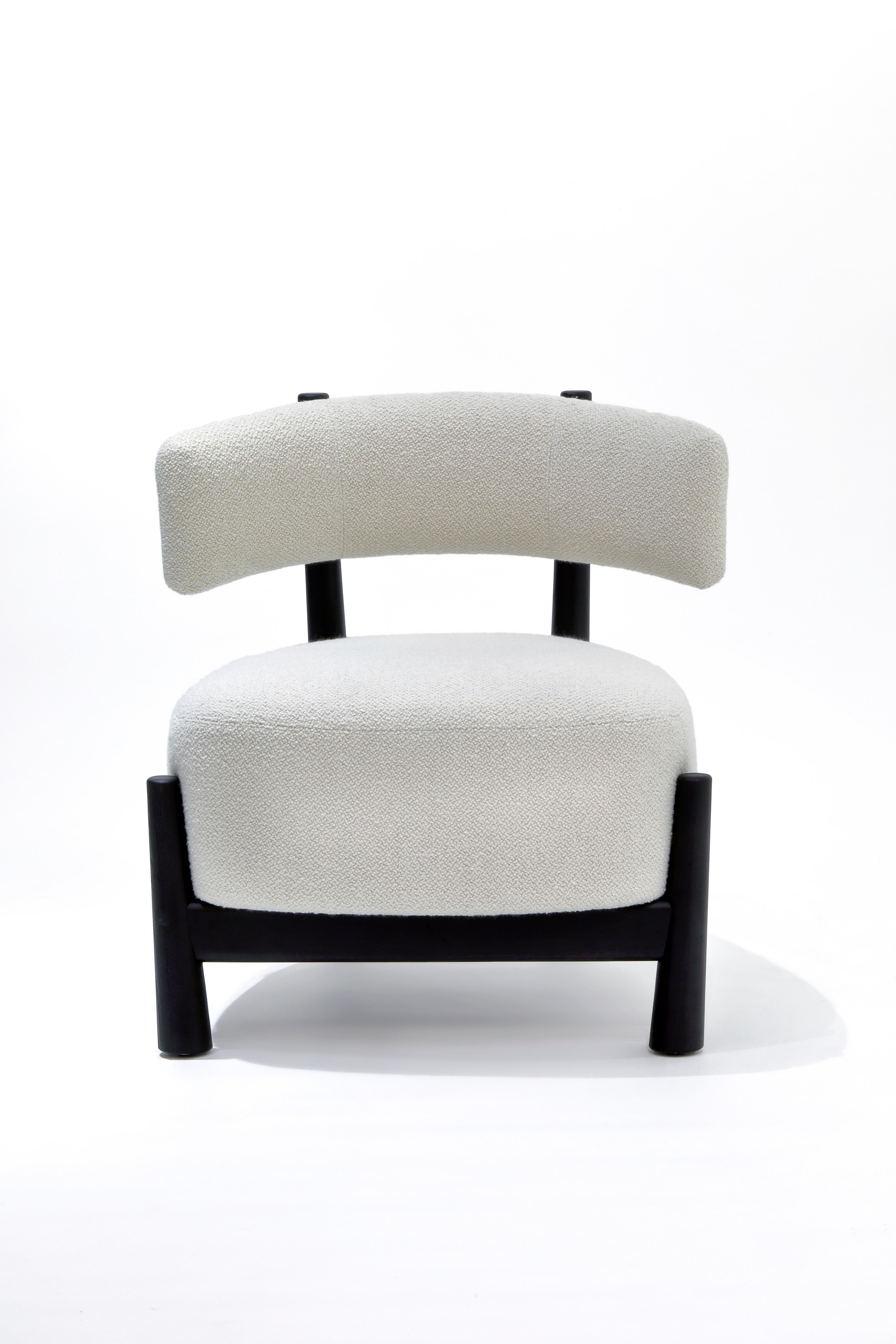 Ash Dalya armchair by Patricia Urquiola
Materials: Solid ash or solid beech.
Technique: Blacked stained ash or coral lacquered beech. Seat and back in polyurethane foam of different densities, upholstered in fabric.
Dimensions: D 70 x W 68 x H 72