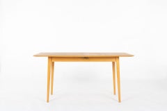 Tavolo da pranzo in frassino con allunga di René-Jean Caillette per Charron, anni '50