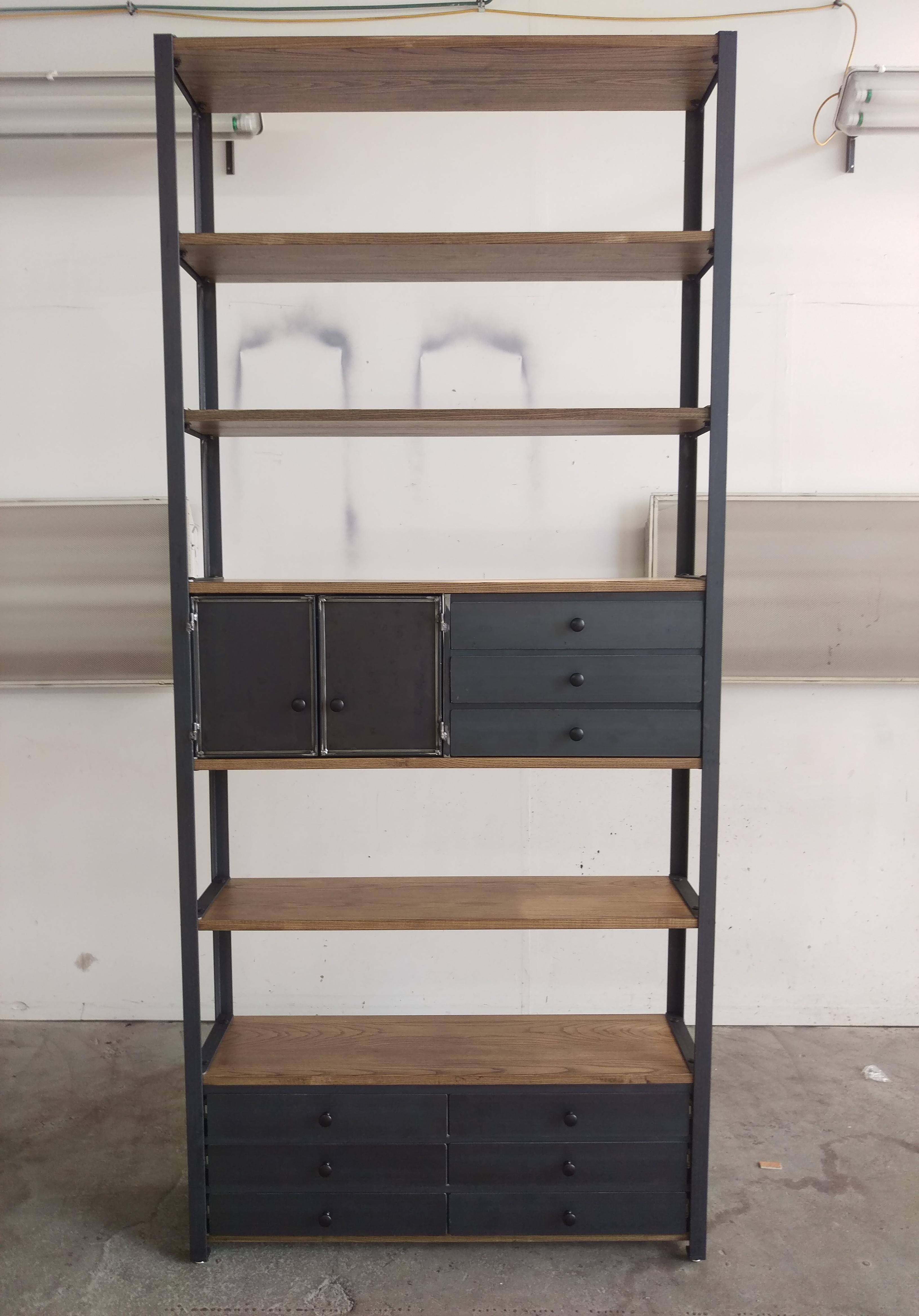 Enhance your space with our Ash Bookcase/ hutch featuring a robust steel frame, meticulously riveted and TIG welded by expert artisans. Crafted from premium domestic ash wood, this bookcase effortlessly marries industrial strength with modern