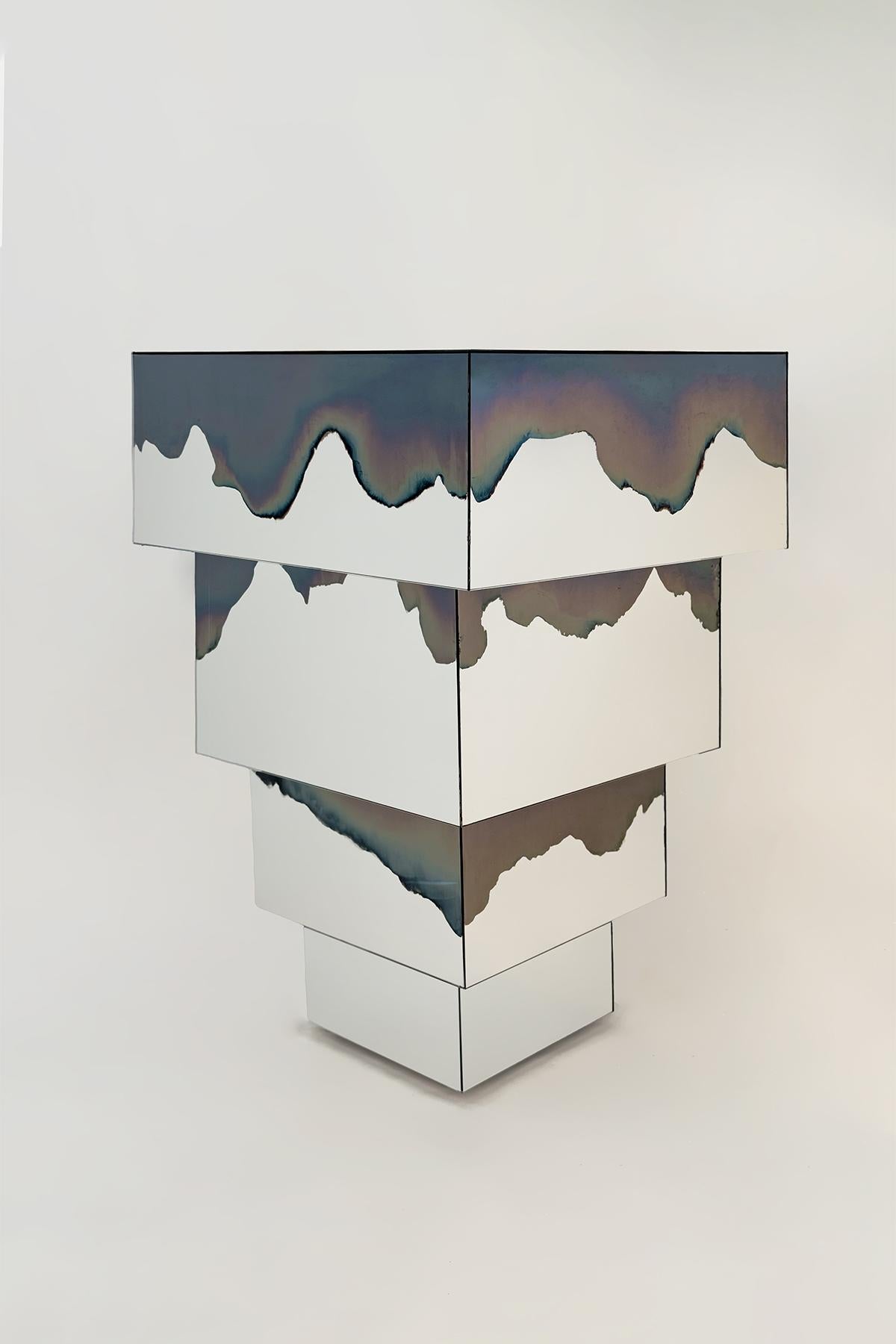 Ash Matryoshka Side Table by Homa
Dimensions: W 60 x D 60 x H 90 cm
Materials: Smoke and Silver Mirror.

HOMA is a contemporary design atelier based in Istanbul. The atelier’s trademark processes are handblown glass, glass fusing and mirroring,
