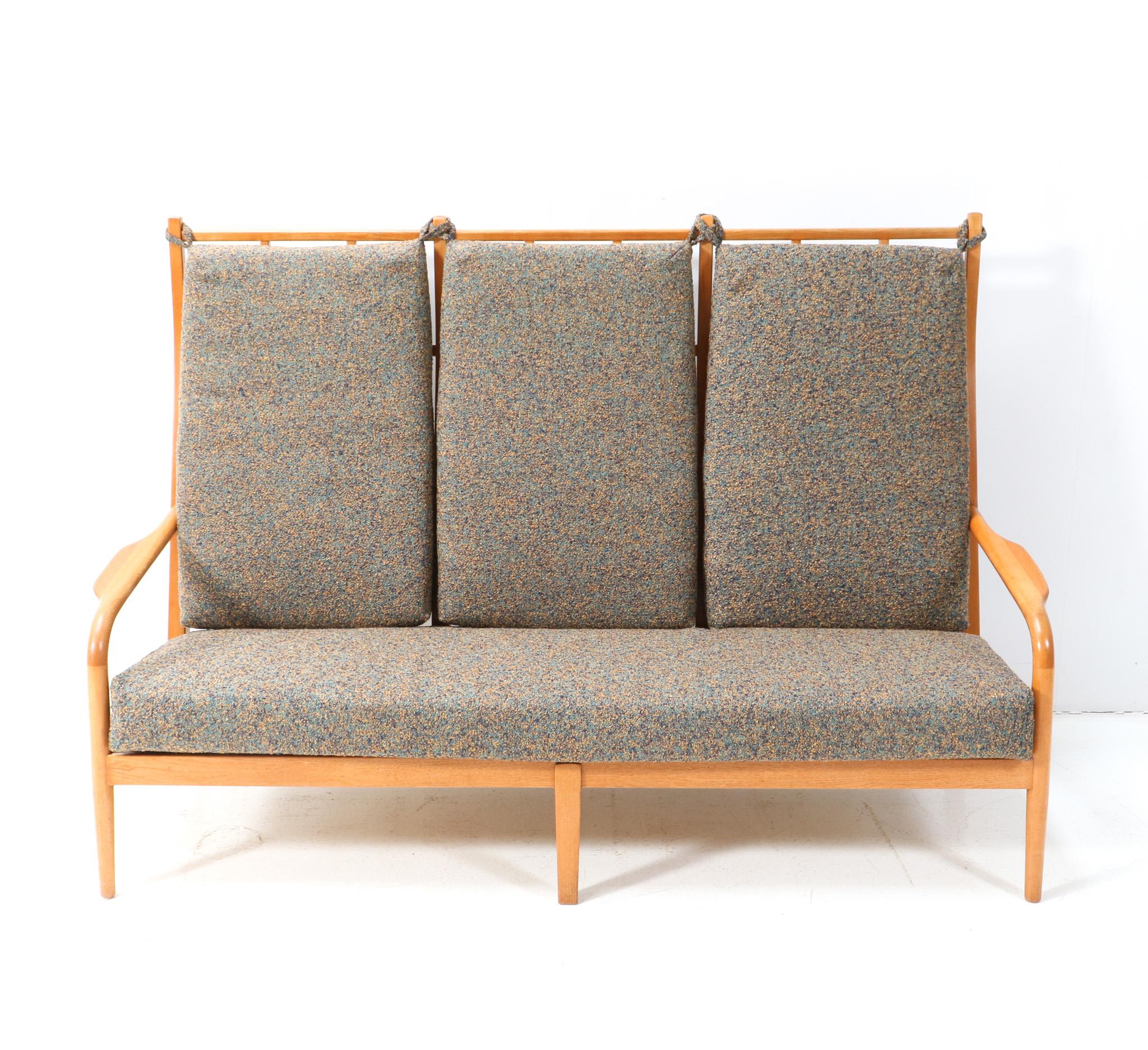 Magnificent and one of a kind Mid-Century Modern high back sofa or bench.
Design by Frits Eschauzier Jr.
Striking Dutch design from the 1960s.
Solid ash frame and the cushions are re-upholstered with a multi-colored Italian quality fabric.
This