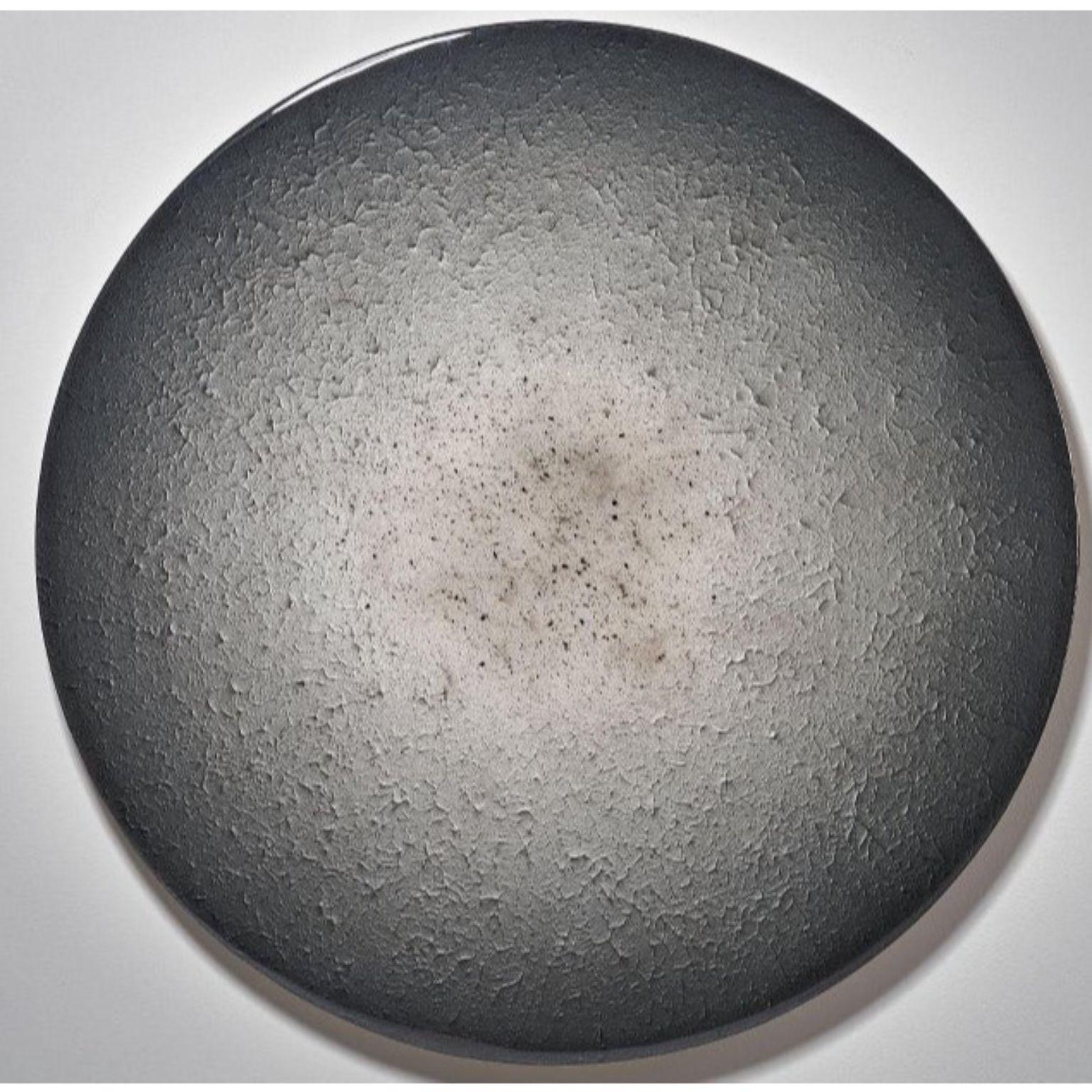 Ash minimalistic round by Corine Vanvoorbergen
Dimensions: diameter 180 cm
Materials: Brass, wood, ash, epoxy and acrylics

 ‘Ash’ symbolizes the outcome, almost like a relic of the intense passion that came before. This is never the end, as