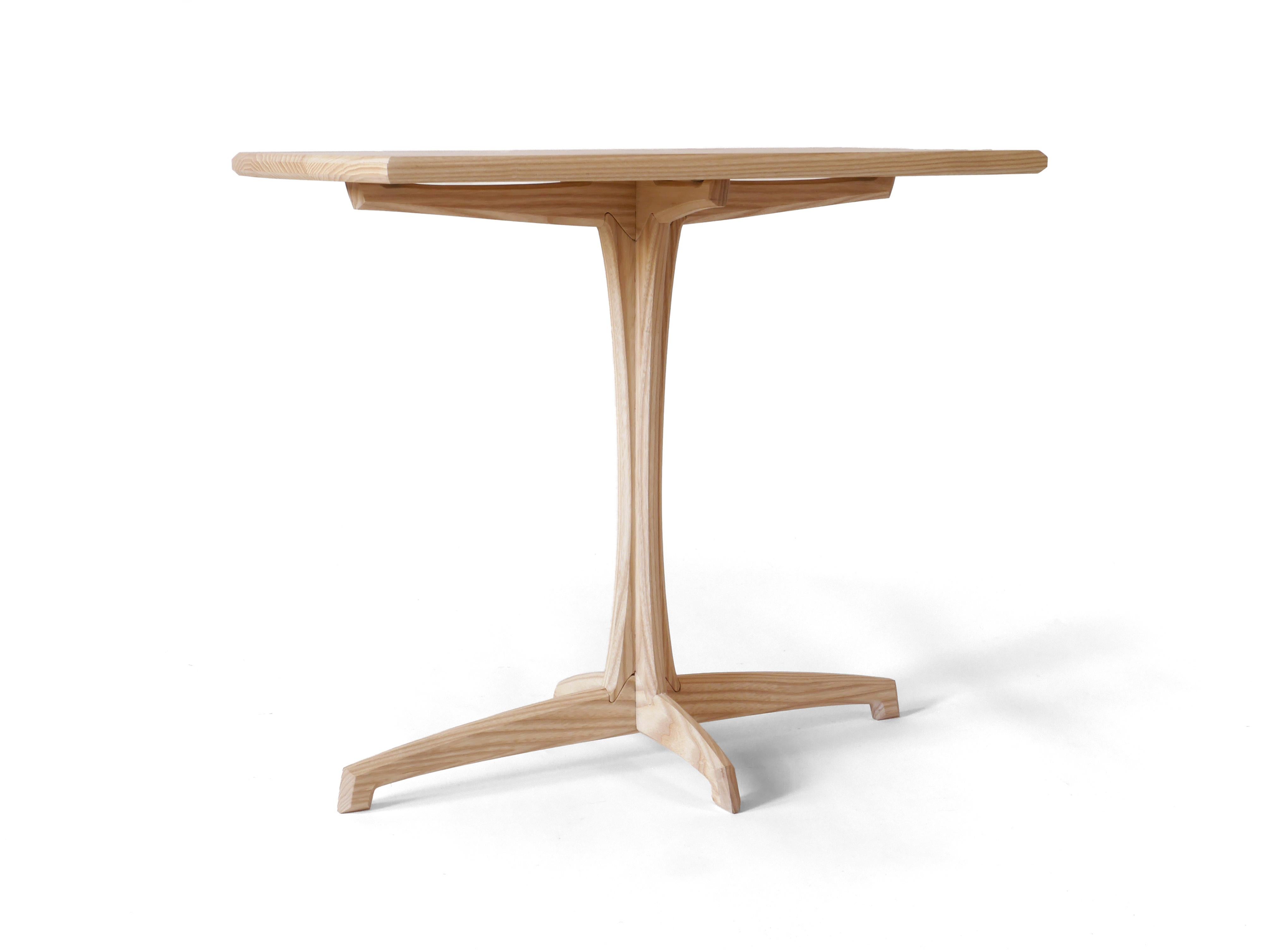 We have one of these in stock right now, available for immediate shipment.

This elegant Plume Side Table is made out of solid white ash hardwood and has a detail rich grace highlighted by its simplicity. Each piece is built to order one at a time