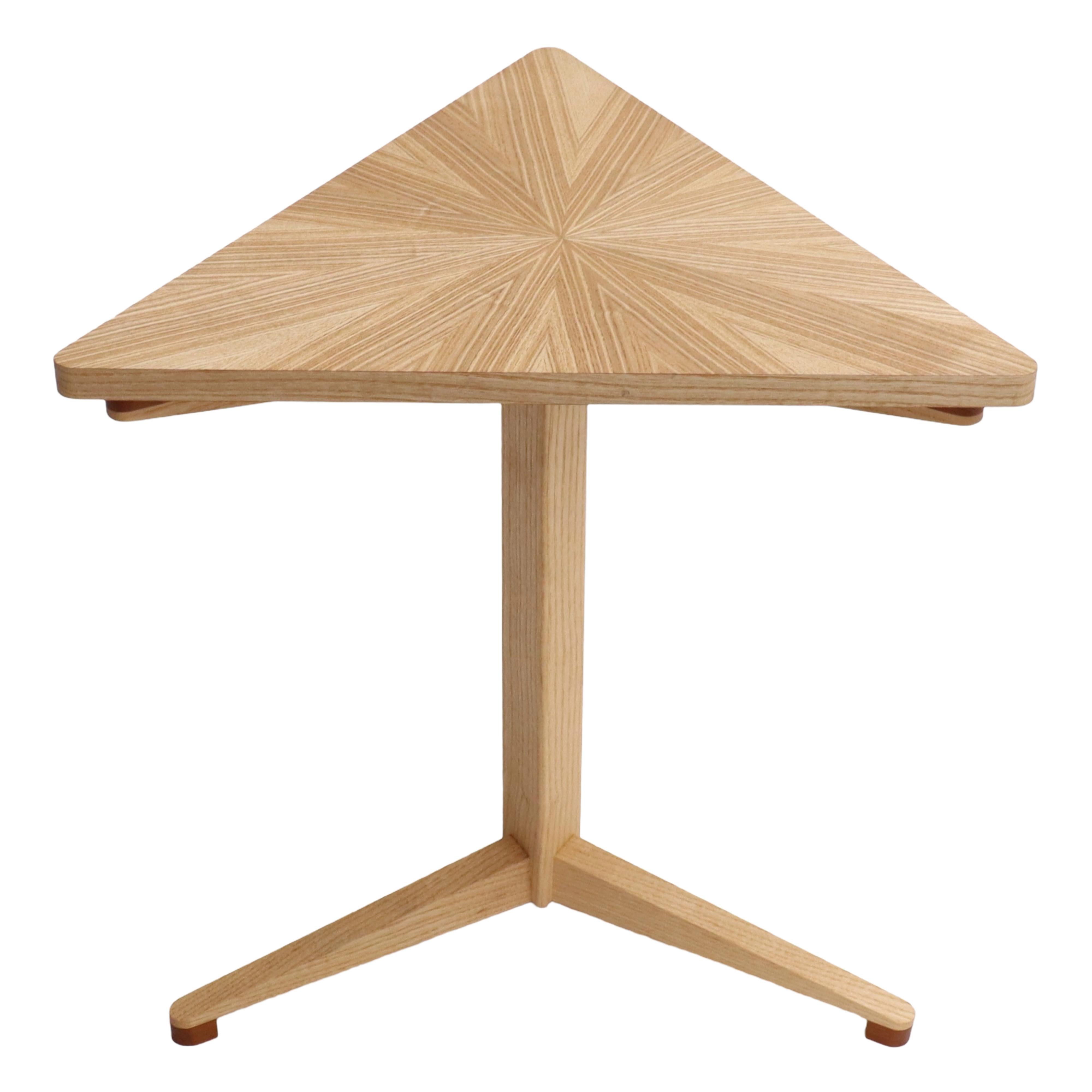 This ash starburst triform pedestal side table has been crafted with the utmost care and attention to detail. Inspired by contemporary minimalist design, it's crisp, clean lines and symmetry add balance and harmony to your living space. 

Made in