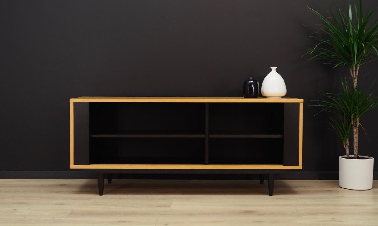 Fantastic TV cabinet from the 1960s-1970s. Scandinavian design, Minimalist form, superb quality of workmanship. Furniture finished with ash veneer. Two shelves with adjustable height. Maintained in good condition (minor bruises and scratches),