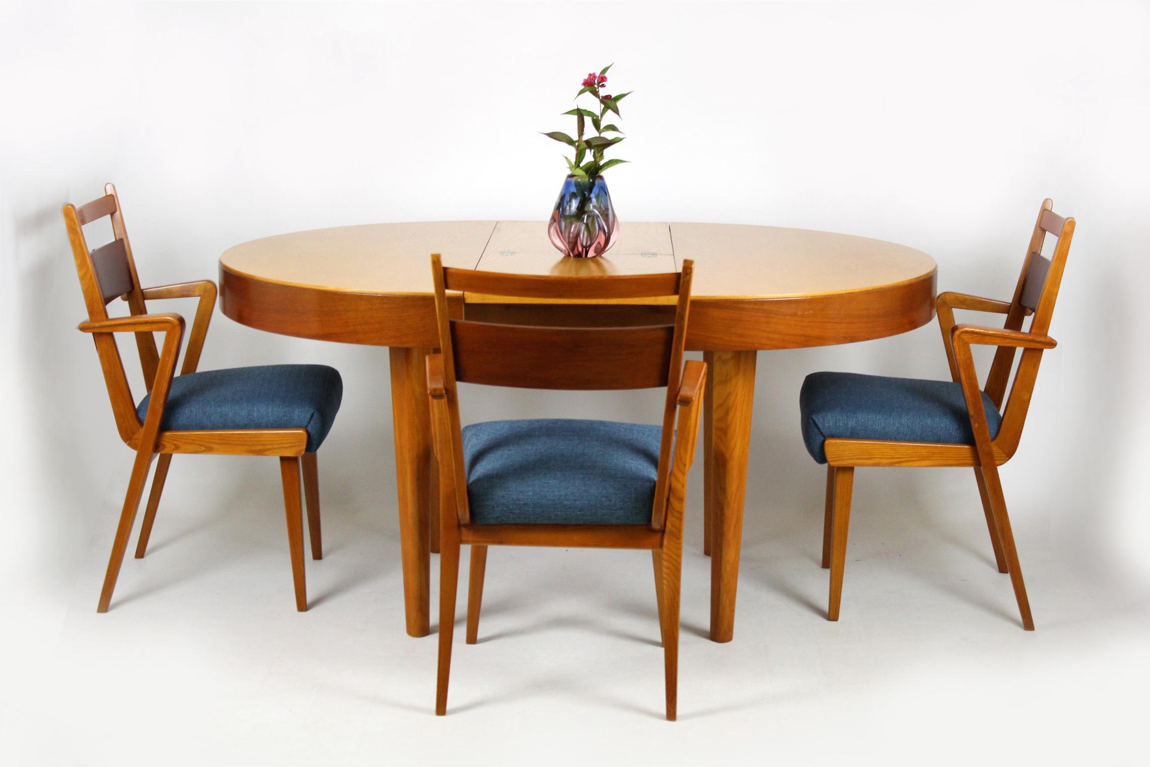 These ash and walnut dining chairs were made by Jitona Sobeslav in the 1950s. The seats have been restored and upholstered with new fabric.
The table from this set can be bought additionally.