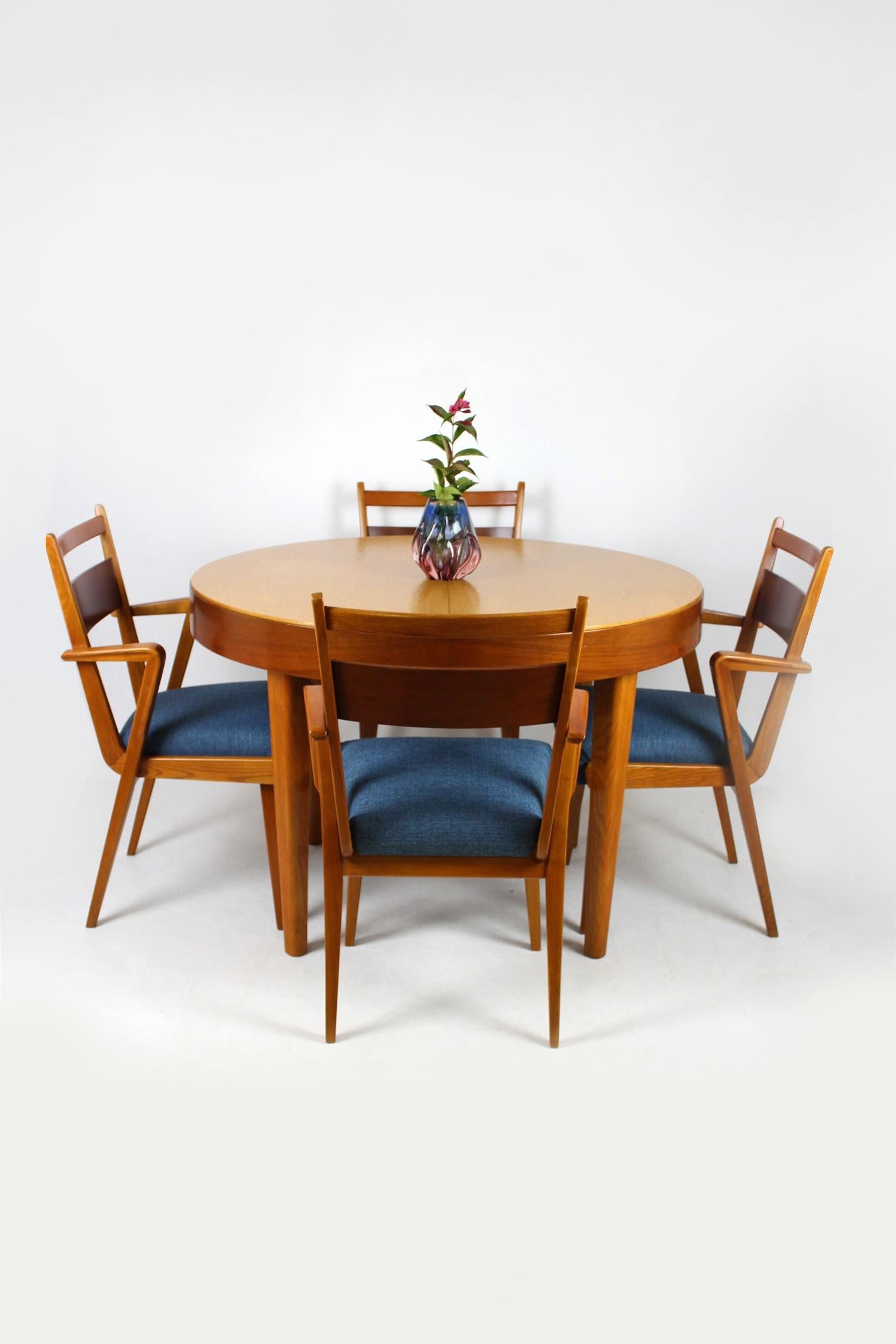 This ash and walnut folding dining table was made by Jitona Sobeslav in 1954. 
The table measures 157cm wide when fully extended.
Chairs from this set can be bought additionally.
The tabletop has been refinished.